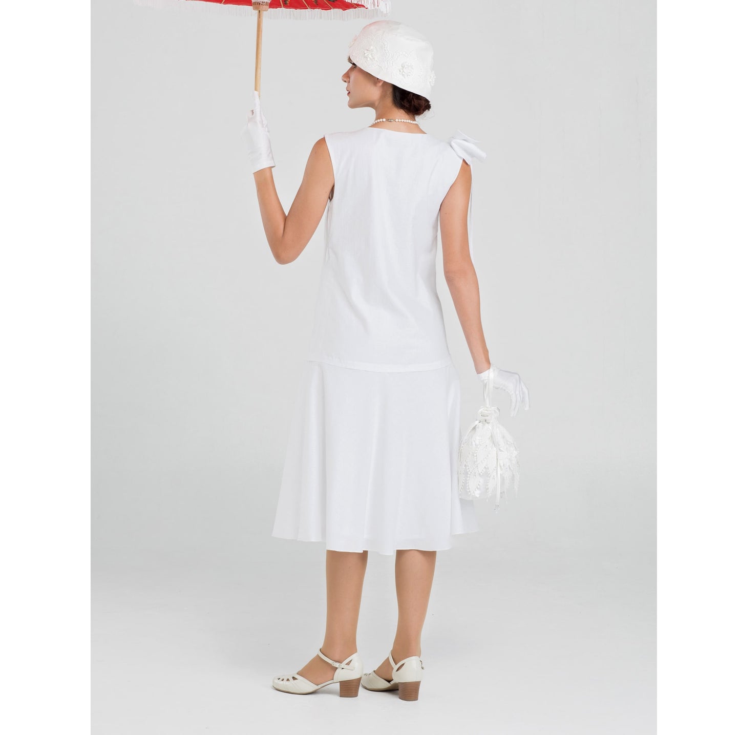 1920s high tea dress in white cotton with bow on shoulder