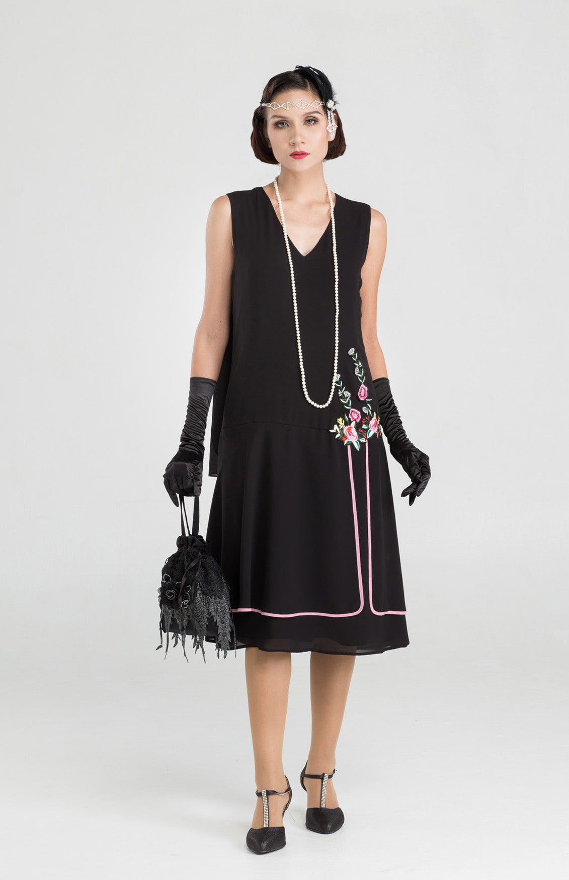 Black 1920s evening dress with a shoulder train