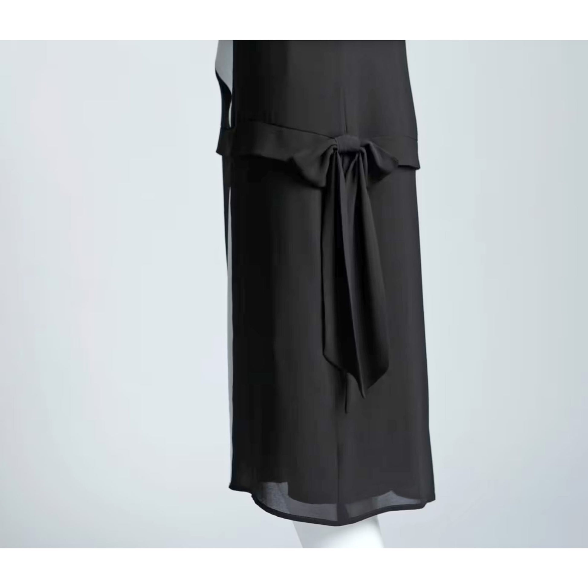 Art deco inspired dress made of black and off-white chiffon fabrics. The Great Gatsby dress, or flapper, has decorative off-white panel on the front bodice.