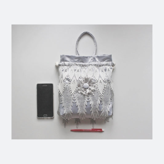 1920s inspired drawstring wristlet in silver satin and grey lace
