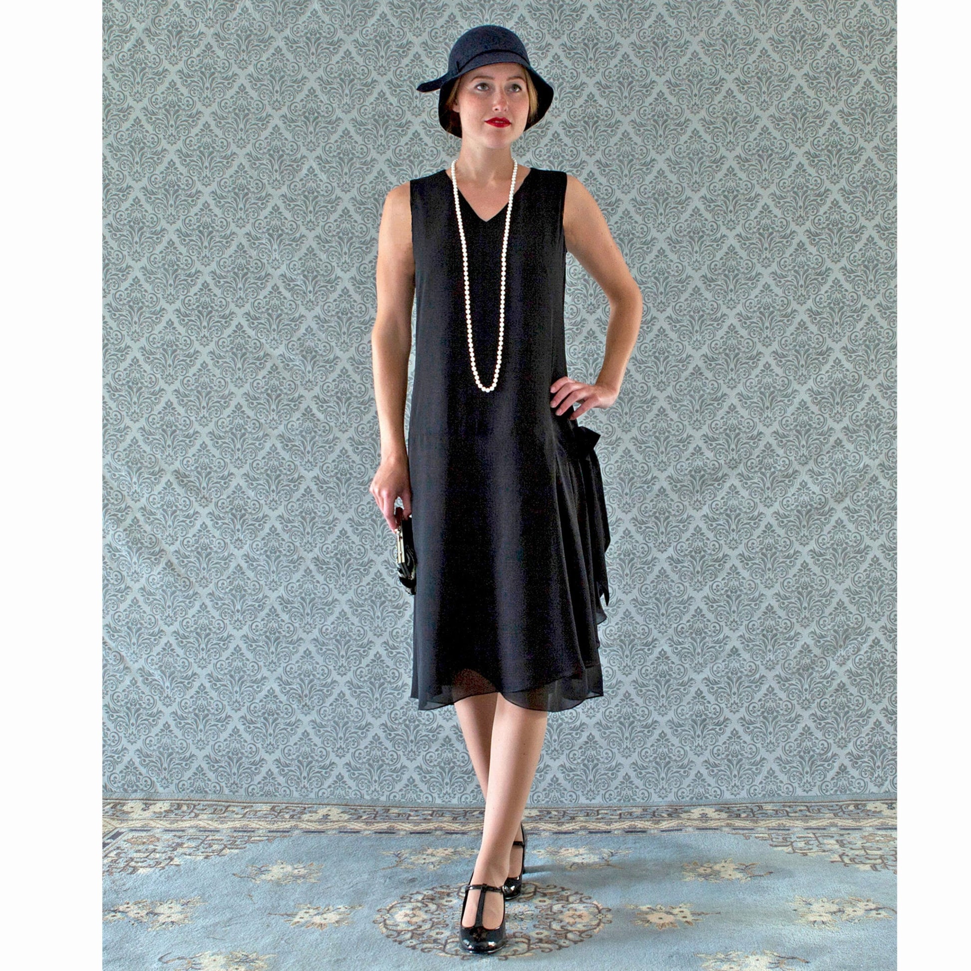 V-neck black flapper dress with drape and bow - a vintage-inspired Roaring Twenties dress