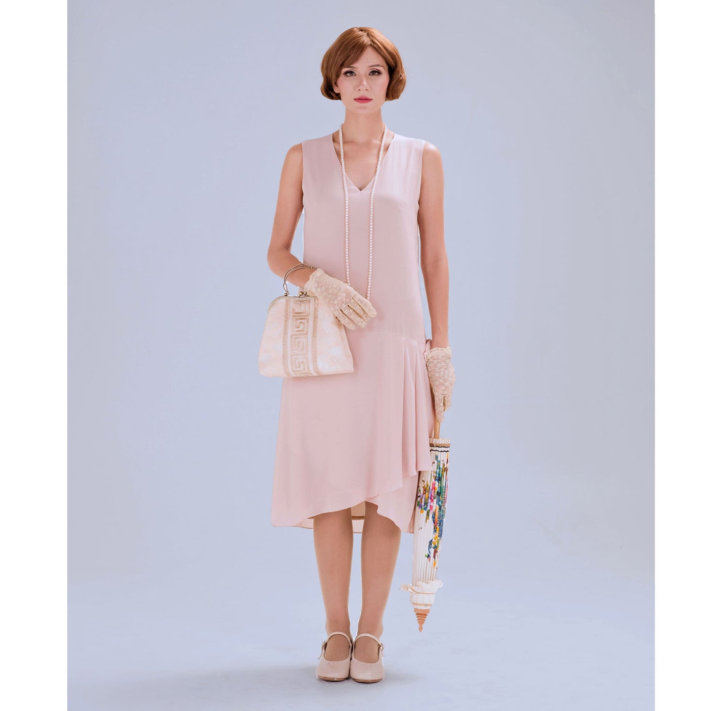 1920s flapper dress with drape and bow in nude color - a vintage-inspired Roaring Twenties dress