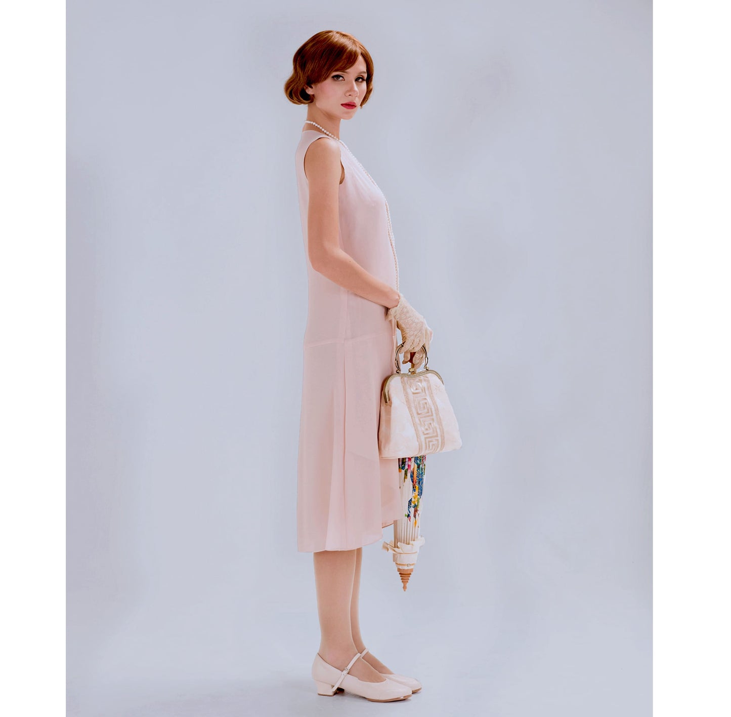 1920s flapper dress with drape and bow in nude color