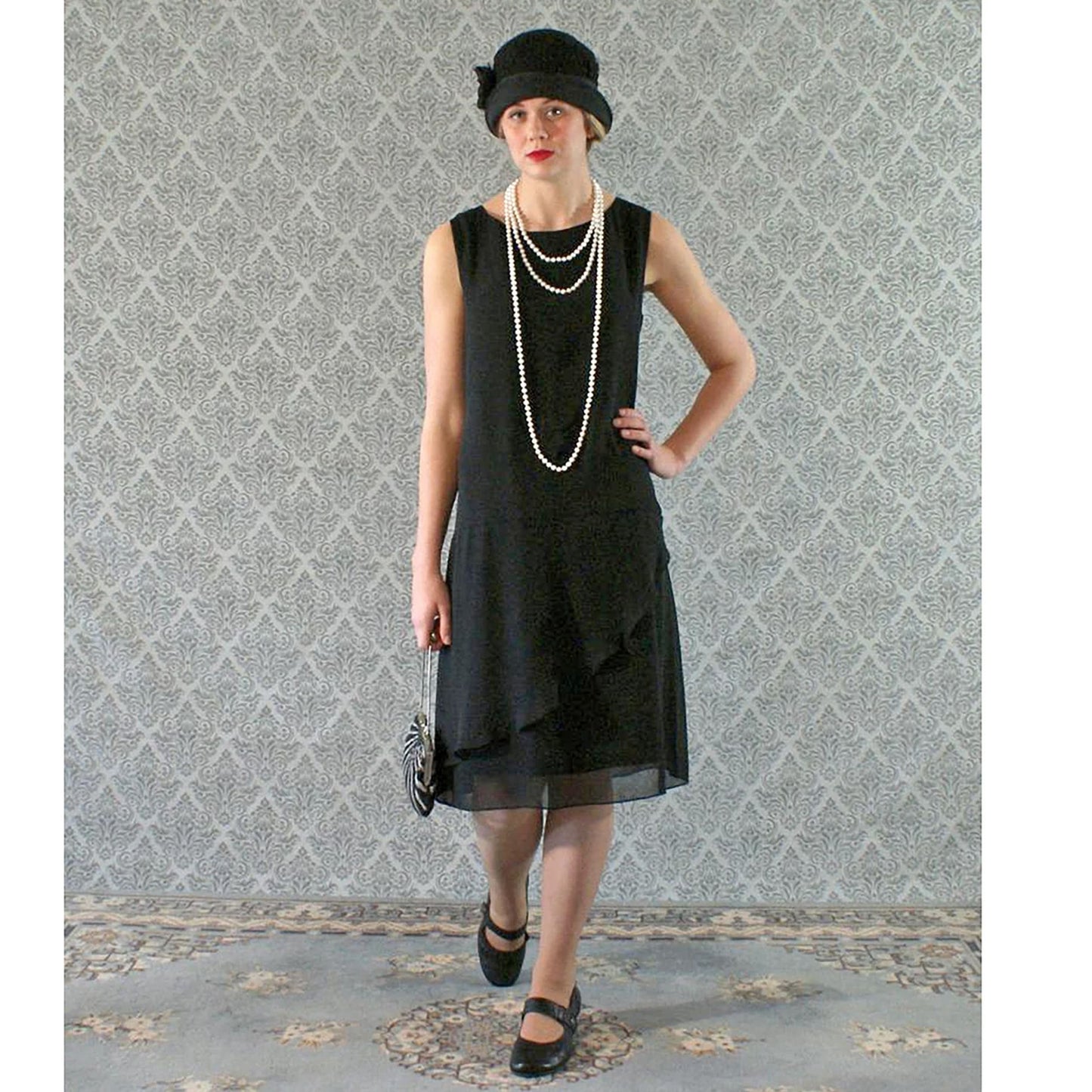 Black chiffon flapper dress with a ruffled skirt detail. The 1920s dress can be worn as a Great Gatsby dress, Jazz Age lawn party dress or Charleston dress.