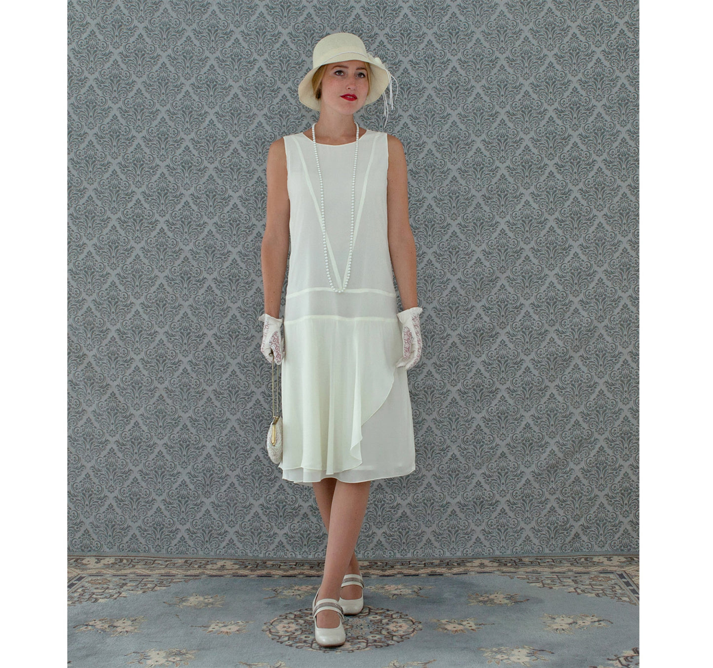 Cream chiffon flapper dress with a ruffled skirt detail - a vintage-inspired Roaring Twenties dress