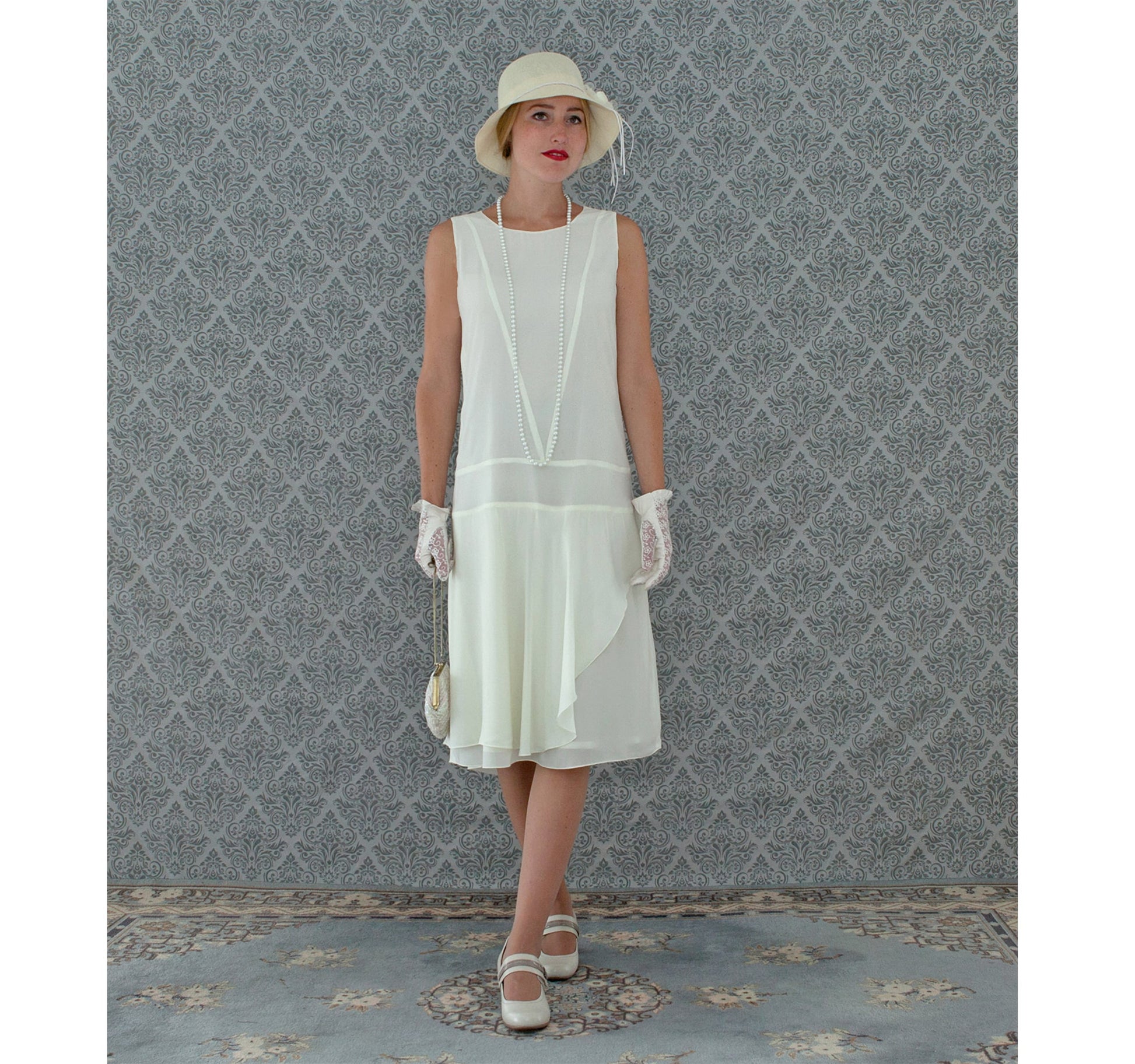 Cream chiffon flapper dress with a ruffled skirt detail - a vintage-inspired Roaring Twenties dress