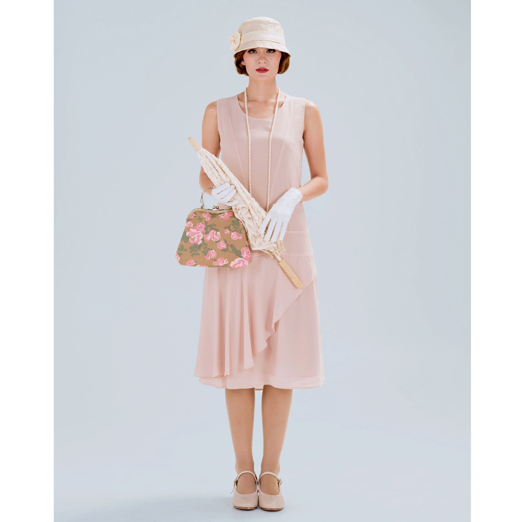 Nude jazz age chiffon flapper dress with a ruffled skirt detail - a vintage-inspired Roaring Twenties dress