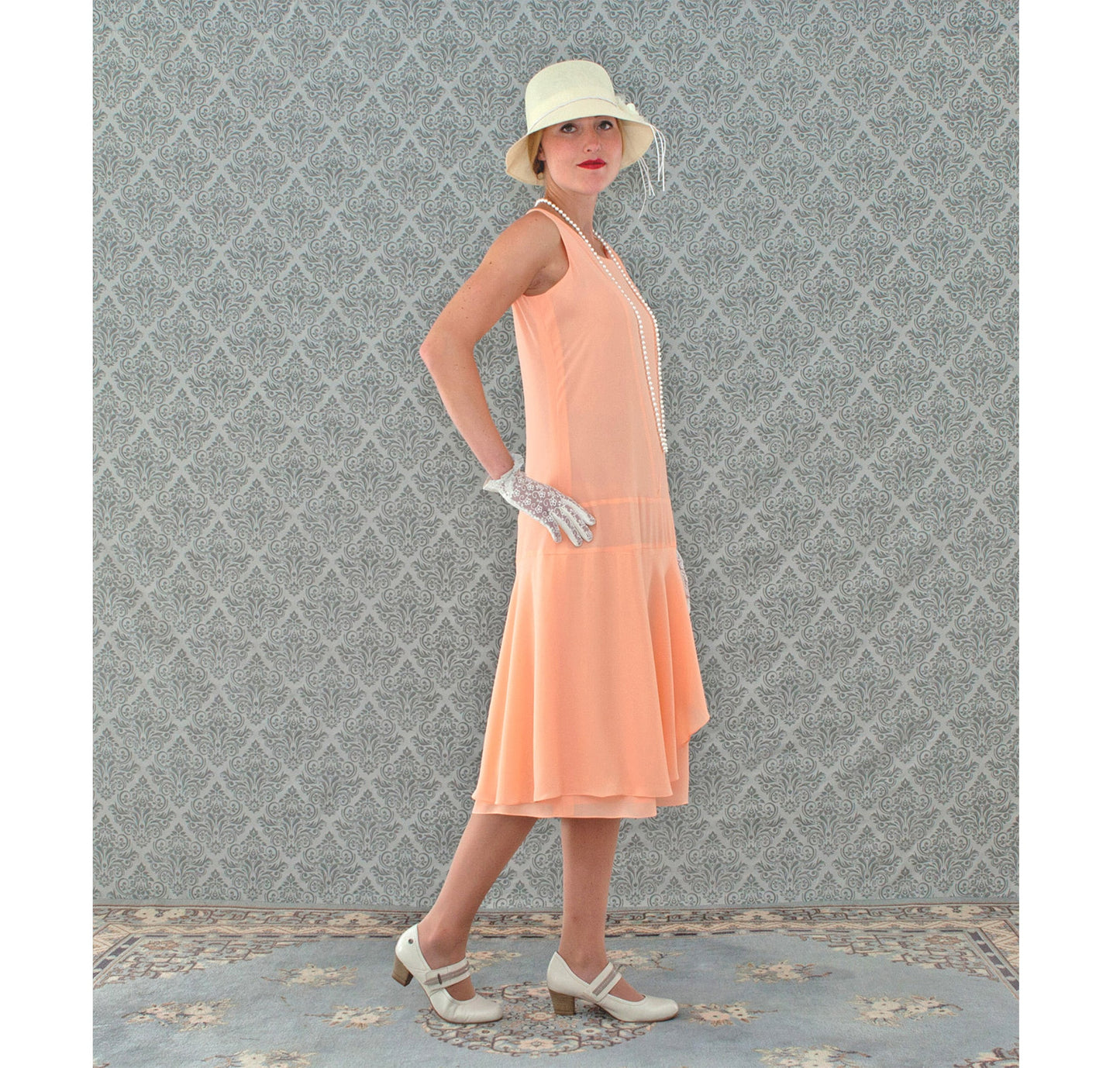 Peach 1920s chiffon dress with ruffled skirt detail