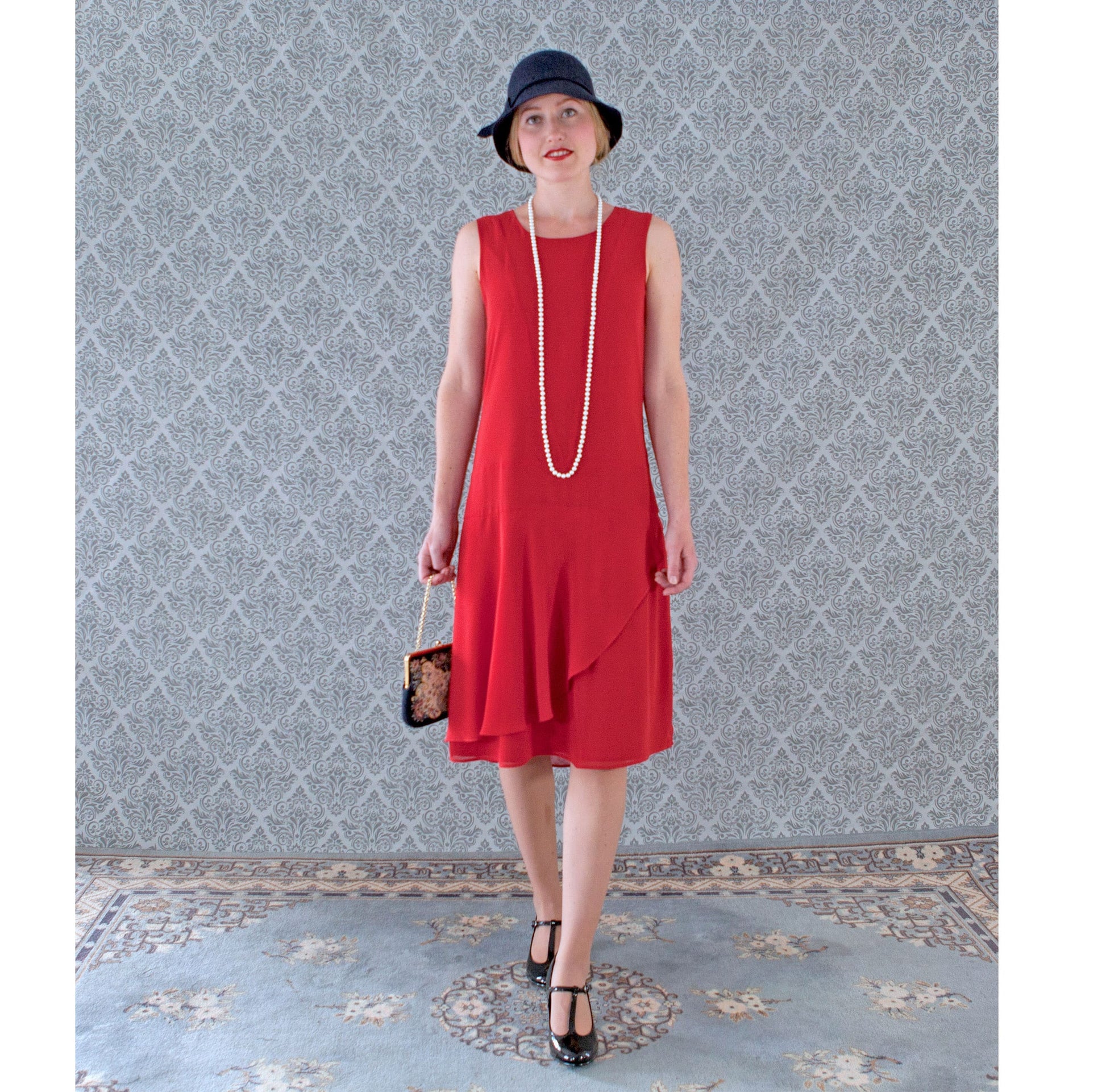 Red chiffon flapper dress with a ruffled skirt detail, a vintage-inspired Roaring Twenties dress