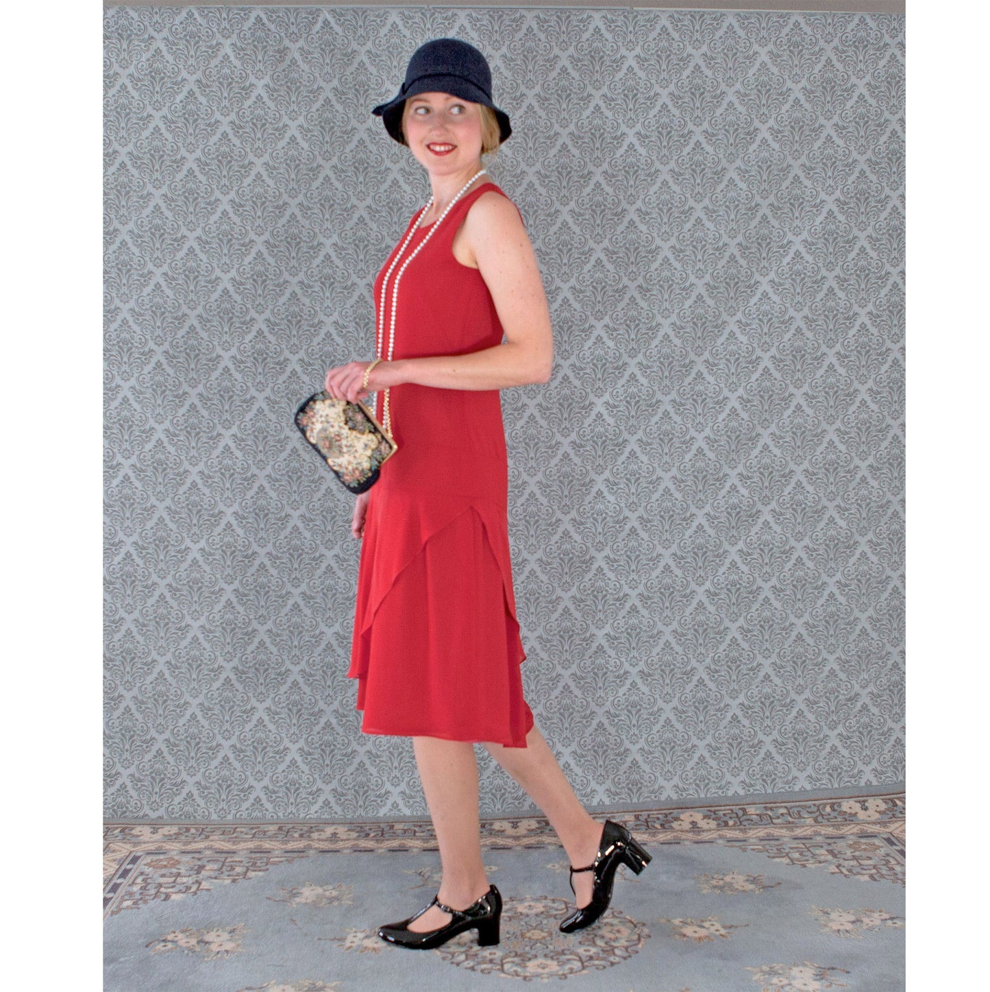 Red chiffon flapper dress with a ruffled skirt detail