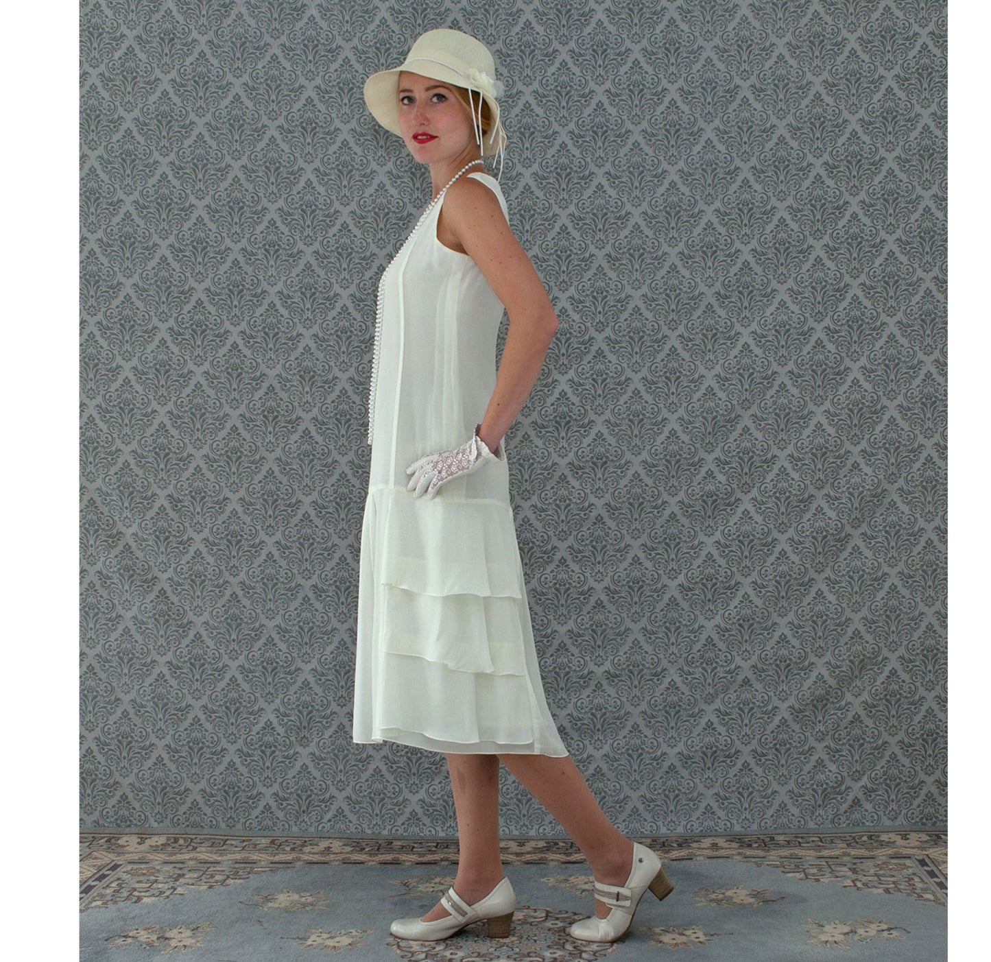 A darling 1920s-inspired dress in cream with tiered skirt
