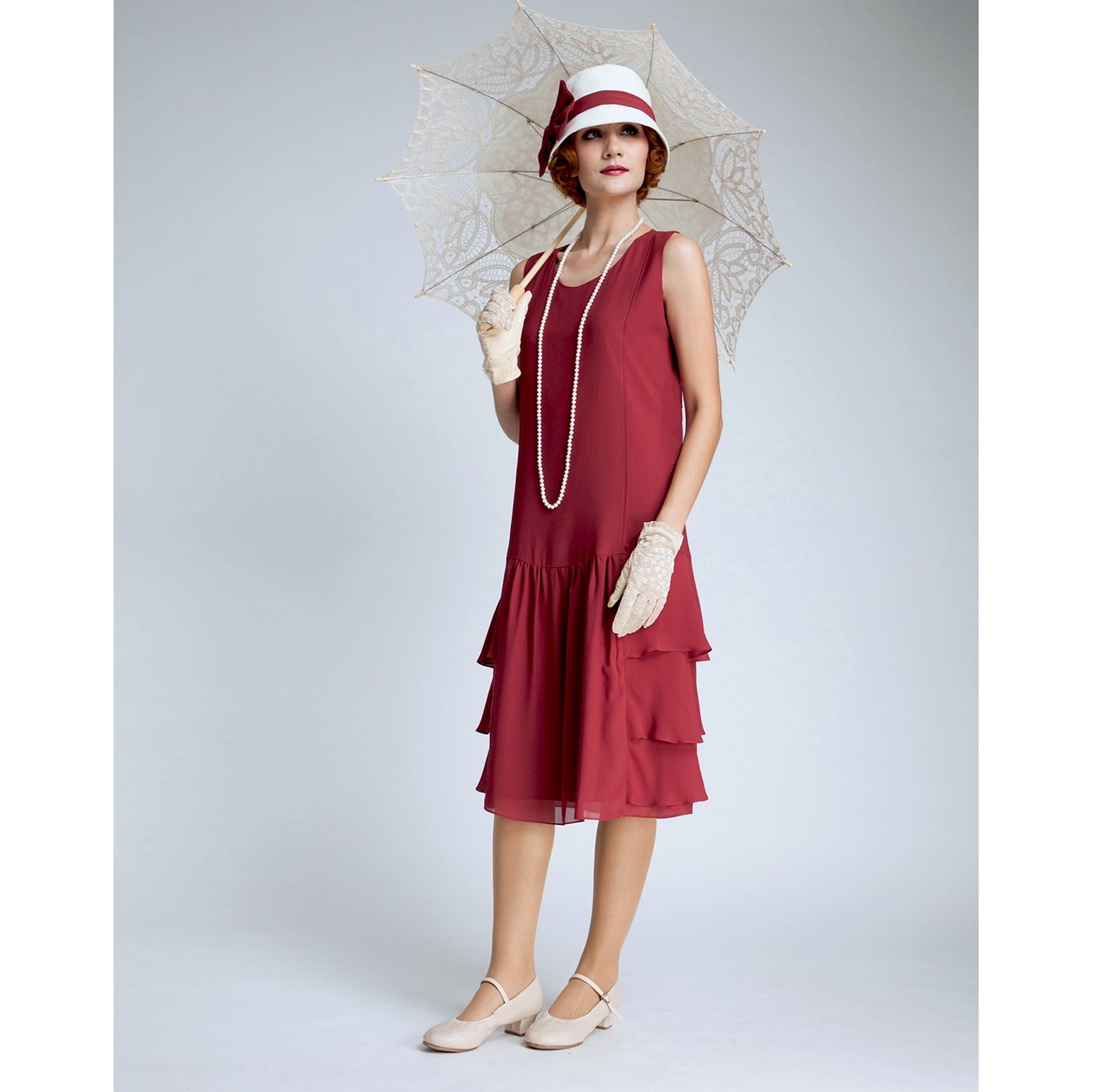 A Great Gatsby dress with a tiered skirt that is made of chiffon fabric and rayon linen fabric