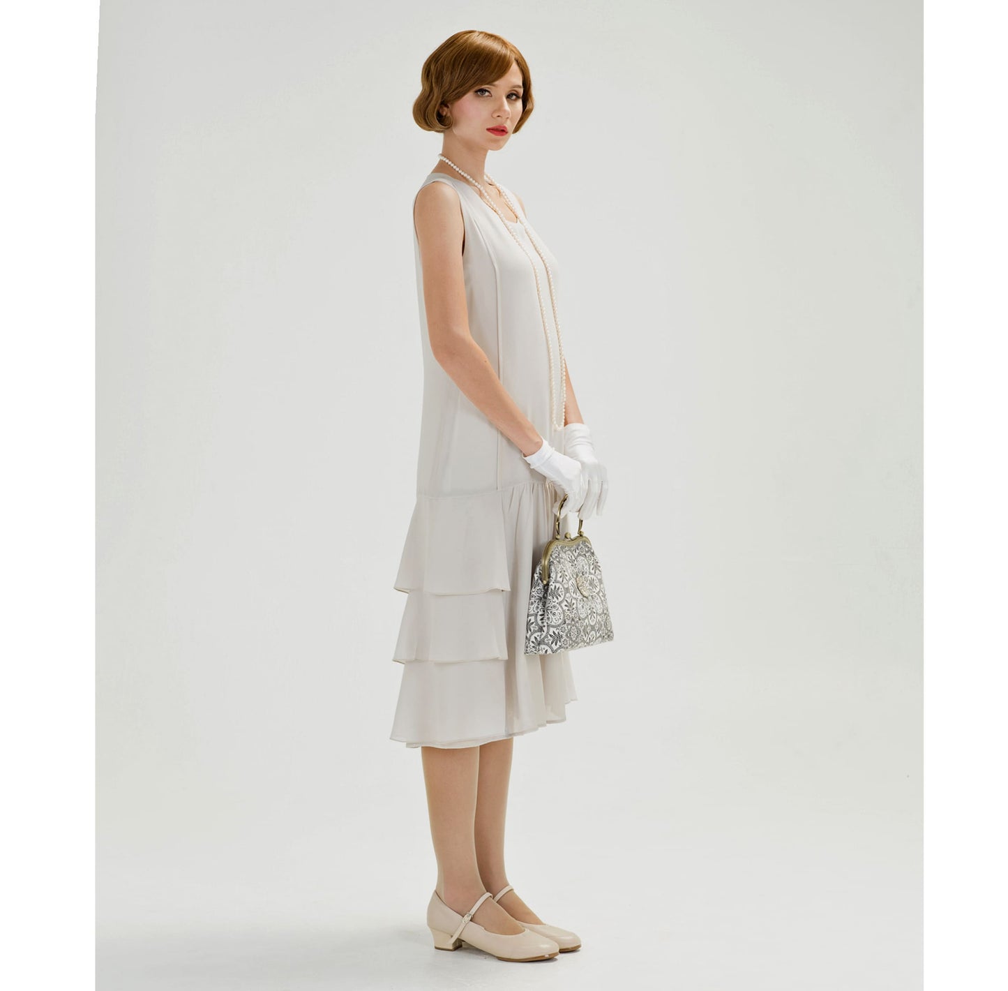 1920s dress in bleached linen color chiffon with tiered skirt. This roaring 20s fashion can be worn as a Great Gatsby dress or Downton Abbey dress.