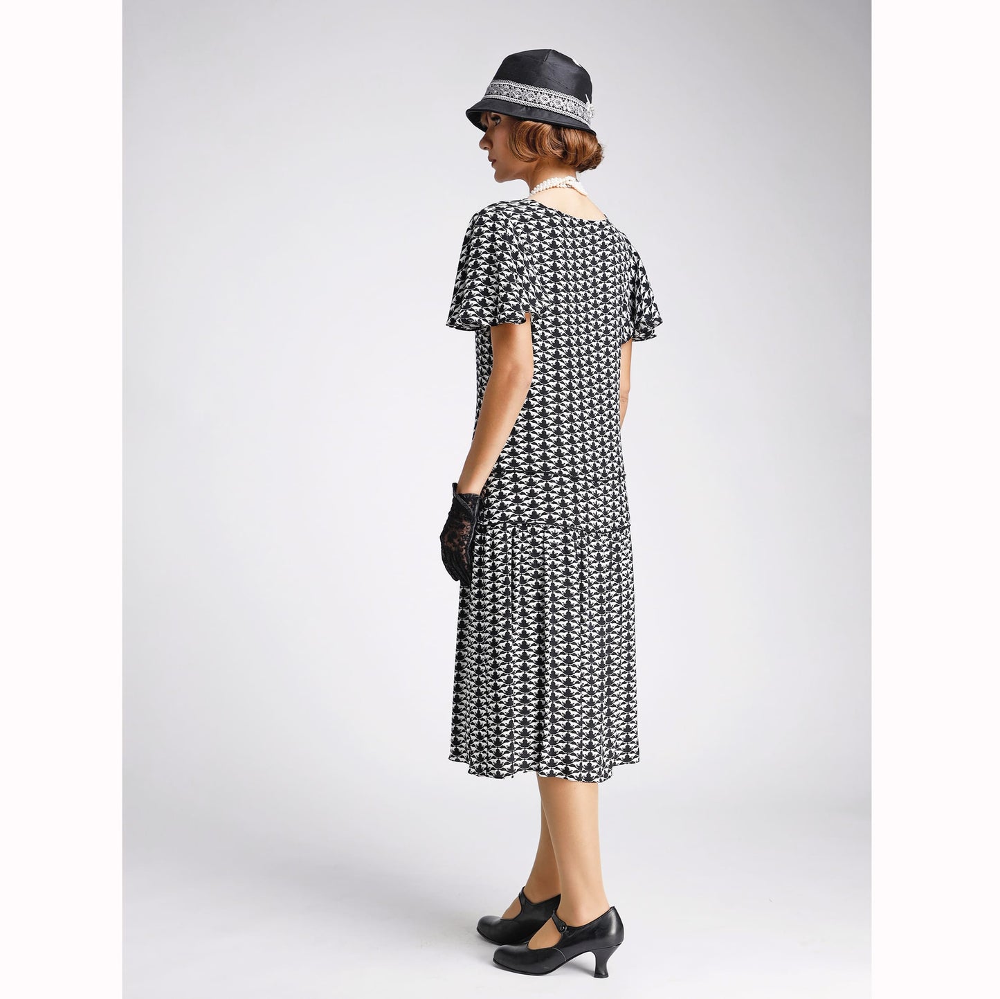 Roaring twenties dress in black and white art deco pattern and flutter sleeves. Can be worn as Great Gatsby dress or 1920s high tea summer dress.