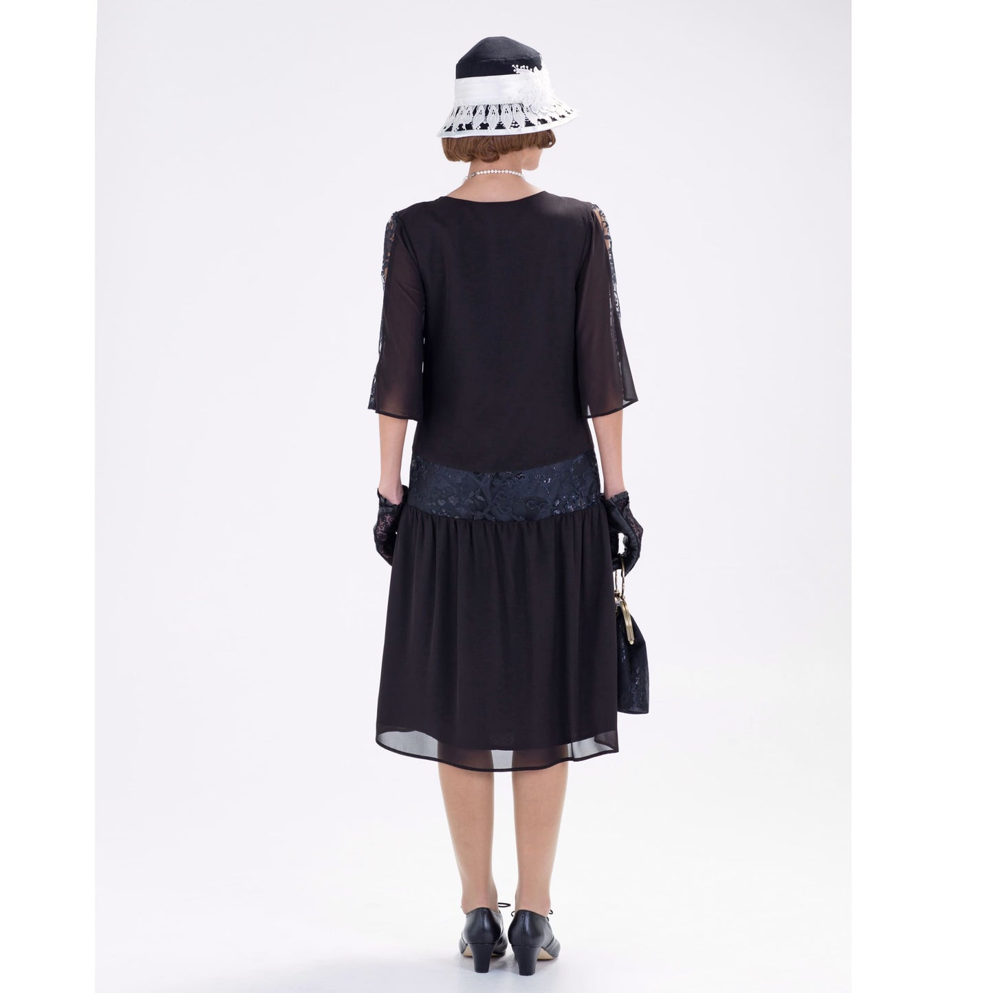 Black 1920s chiffon dress with lace detail on the yoke