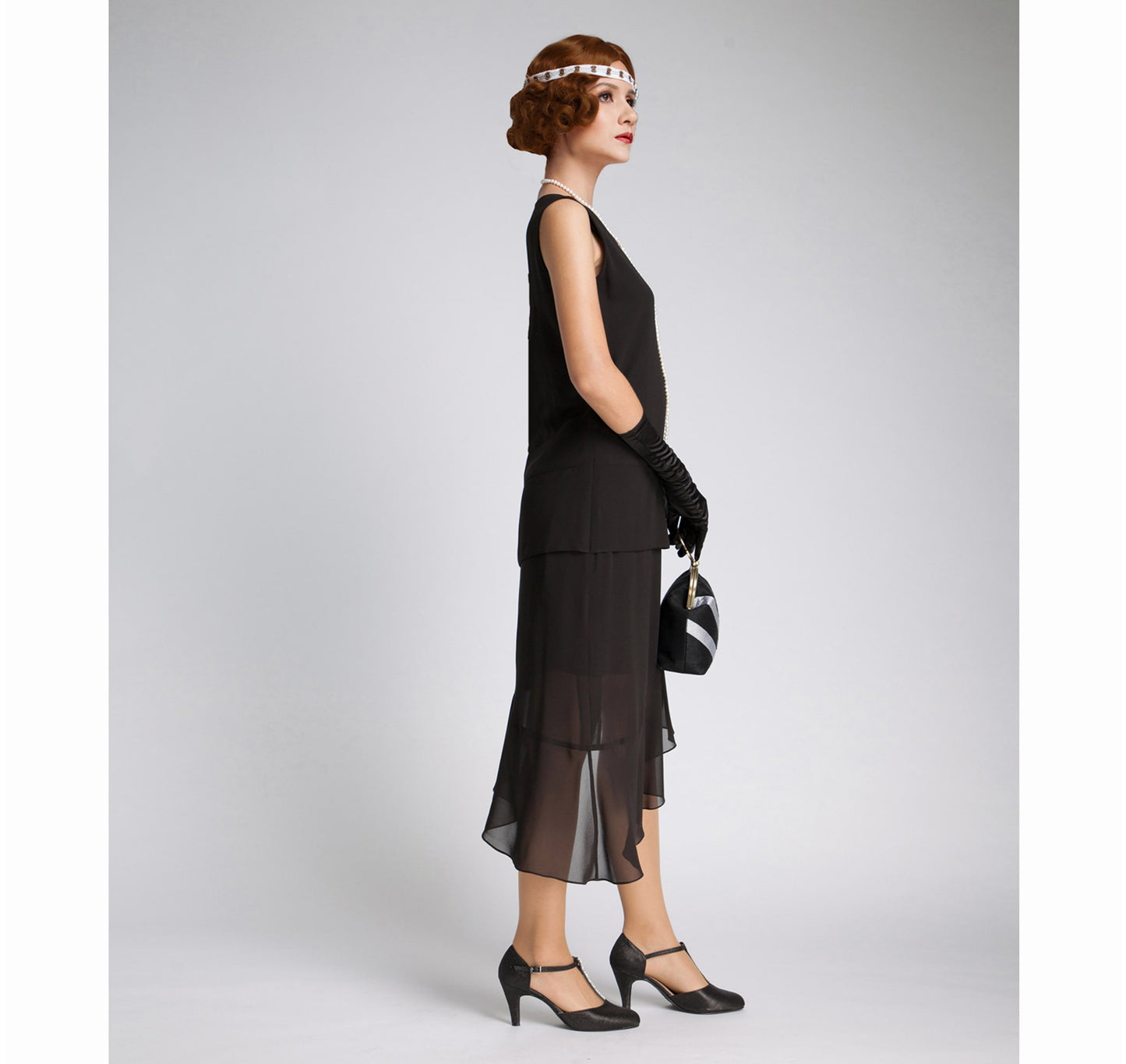 Black chiffon 1920s dress with asymmetrical skirt. The roaring 20s formal dress can be worn as Great Gatsby evening party dress or a black flapper dress.