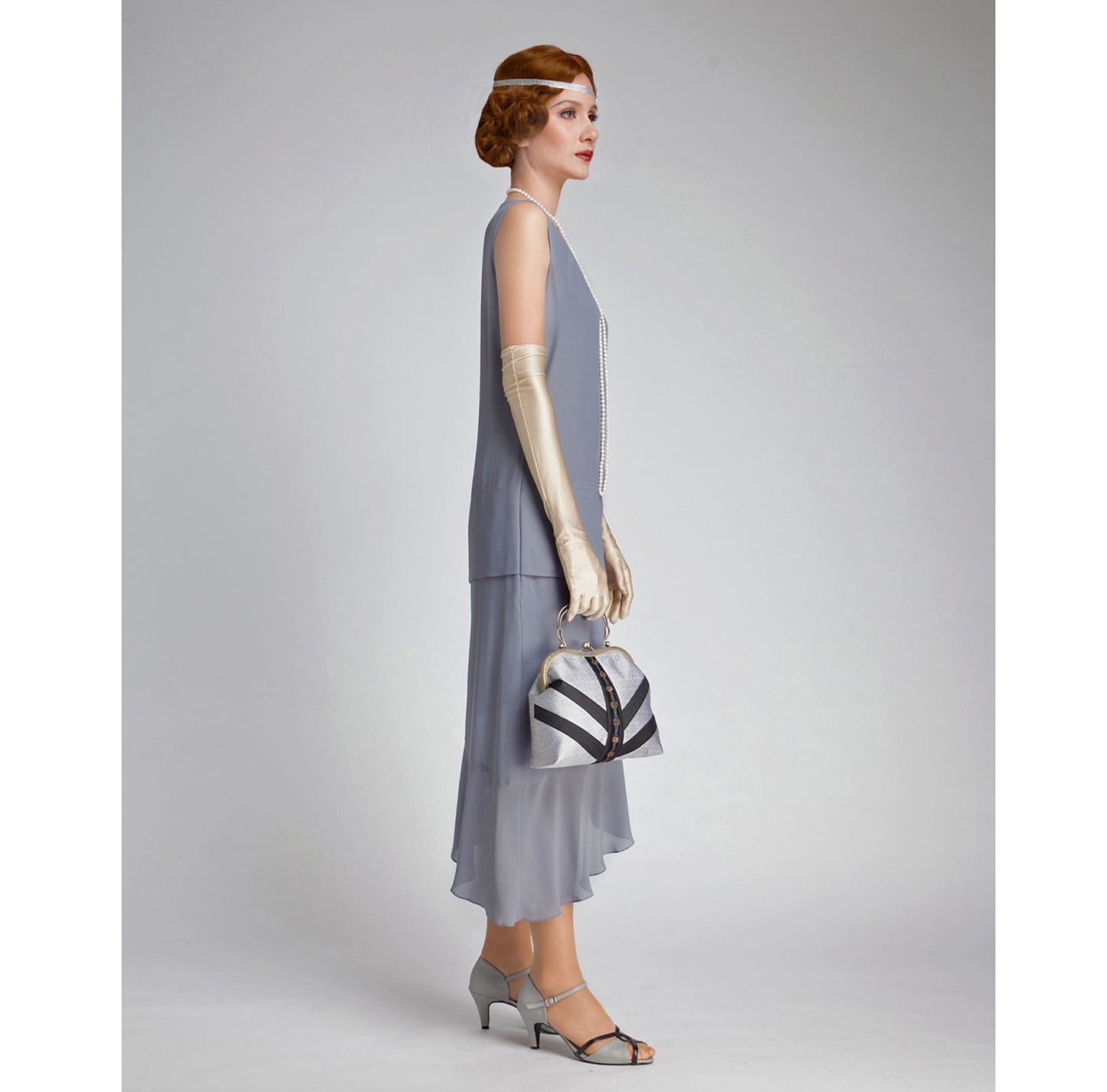 Grey 1920s formal dress with asymmetrical skirt. The 1920s eveningwear can be worn as Great Gatsby dress, 20s flapper dress or Lady Mary dress.