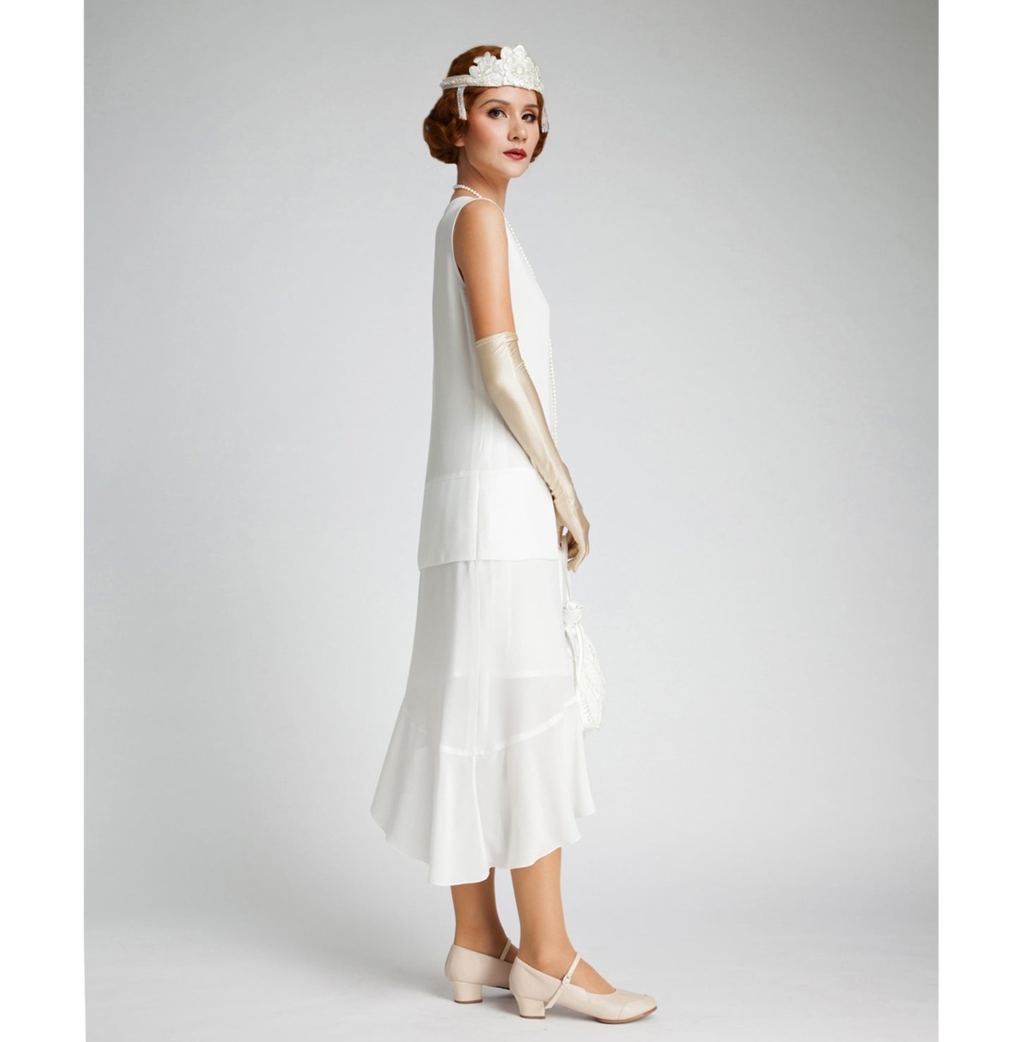Off-white Great Gatsby dress with asymmetrical skirt. The 1920s dress can be worn at any roaring twenties party, also suitable as 1920s wedding dress.