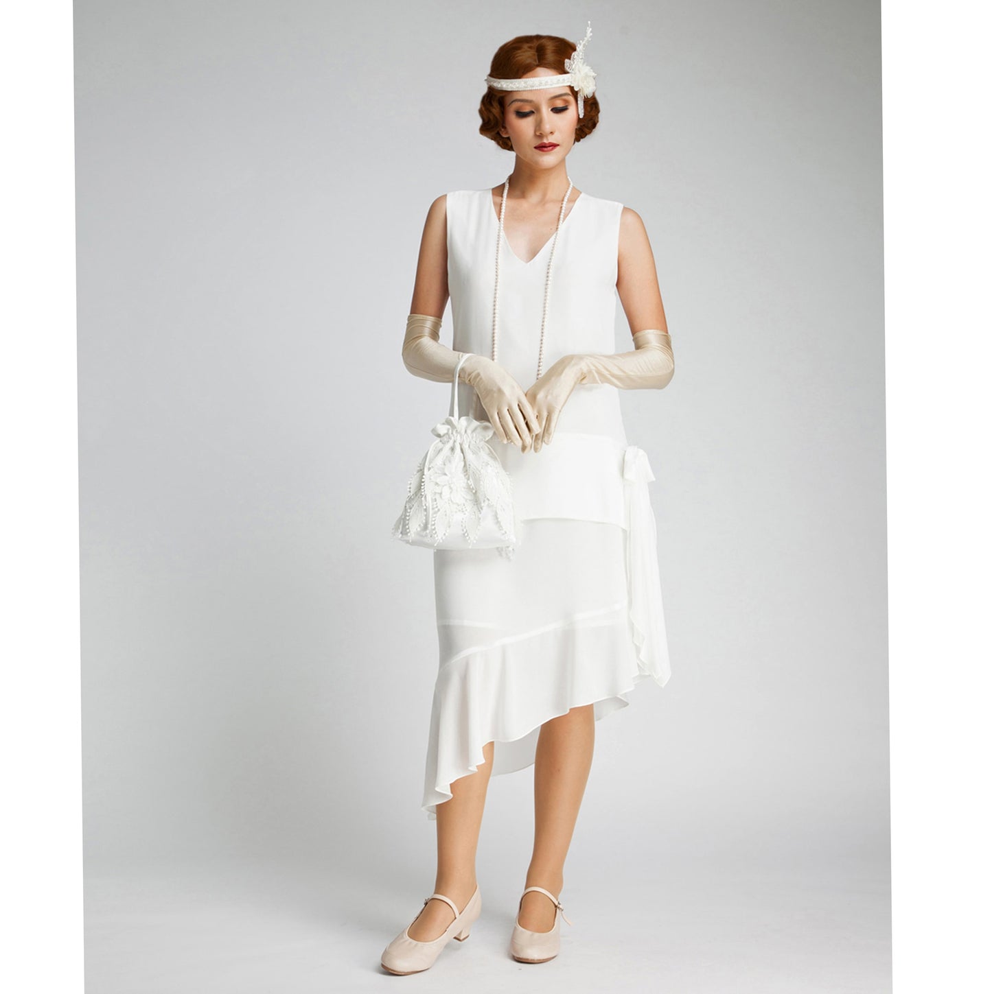 Off-white Great Gatsby dress with an asymmetrical skirt hem