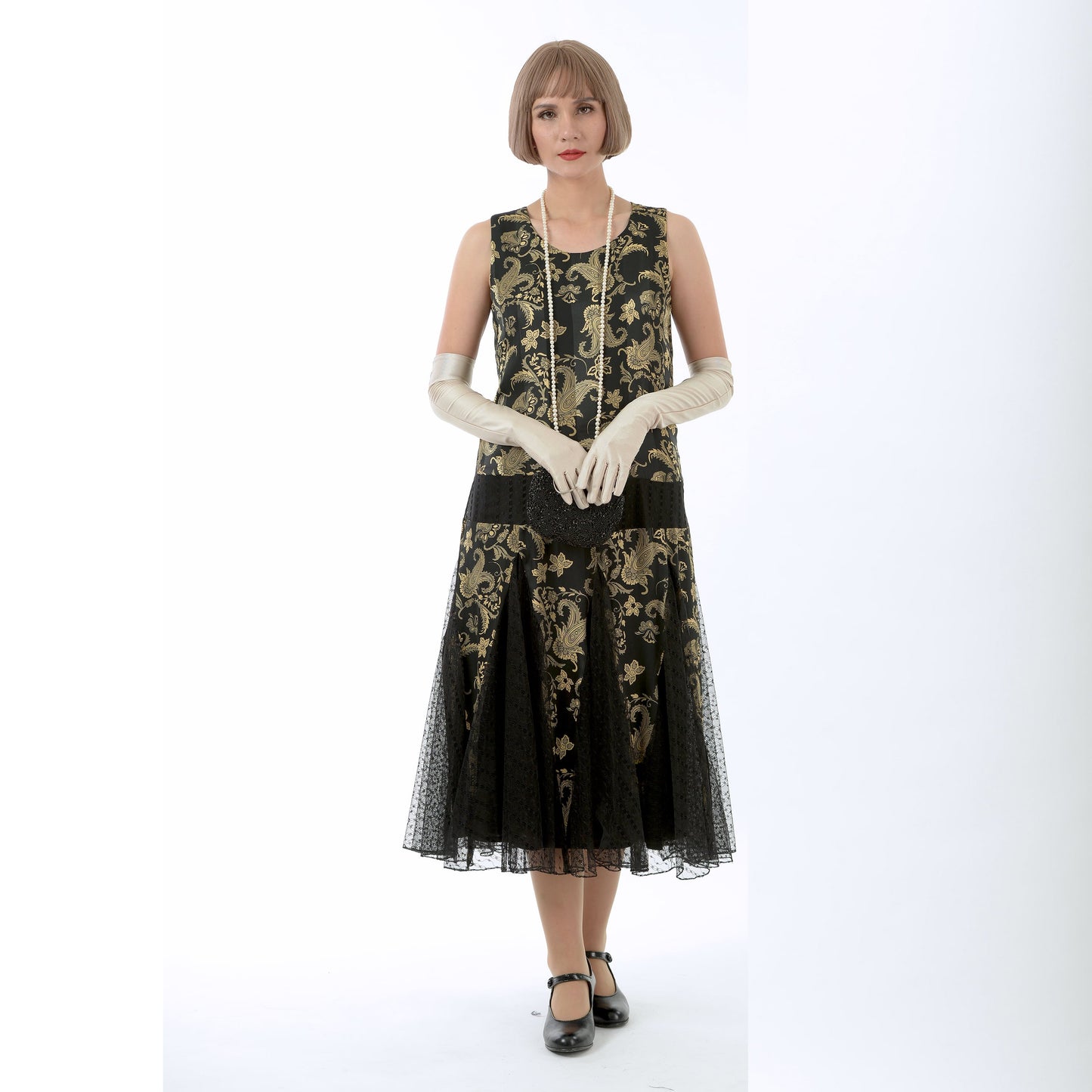 1920s evening dress in black and gold satin with black skirt godets