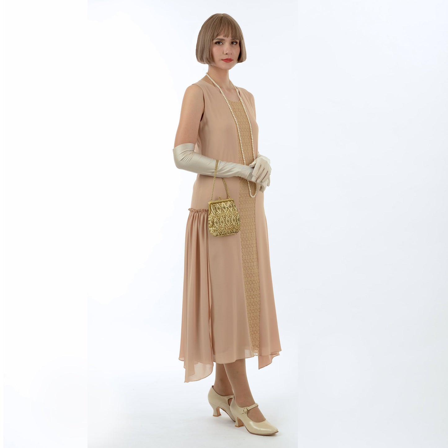 A light brown 1920s reproduction dress with lace inset that can be worn as a Great Gatsby formal evening dress.