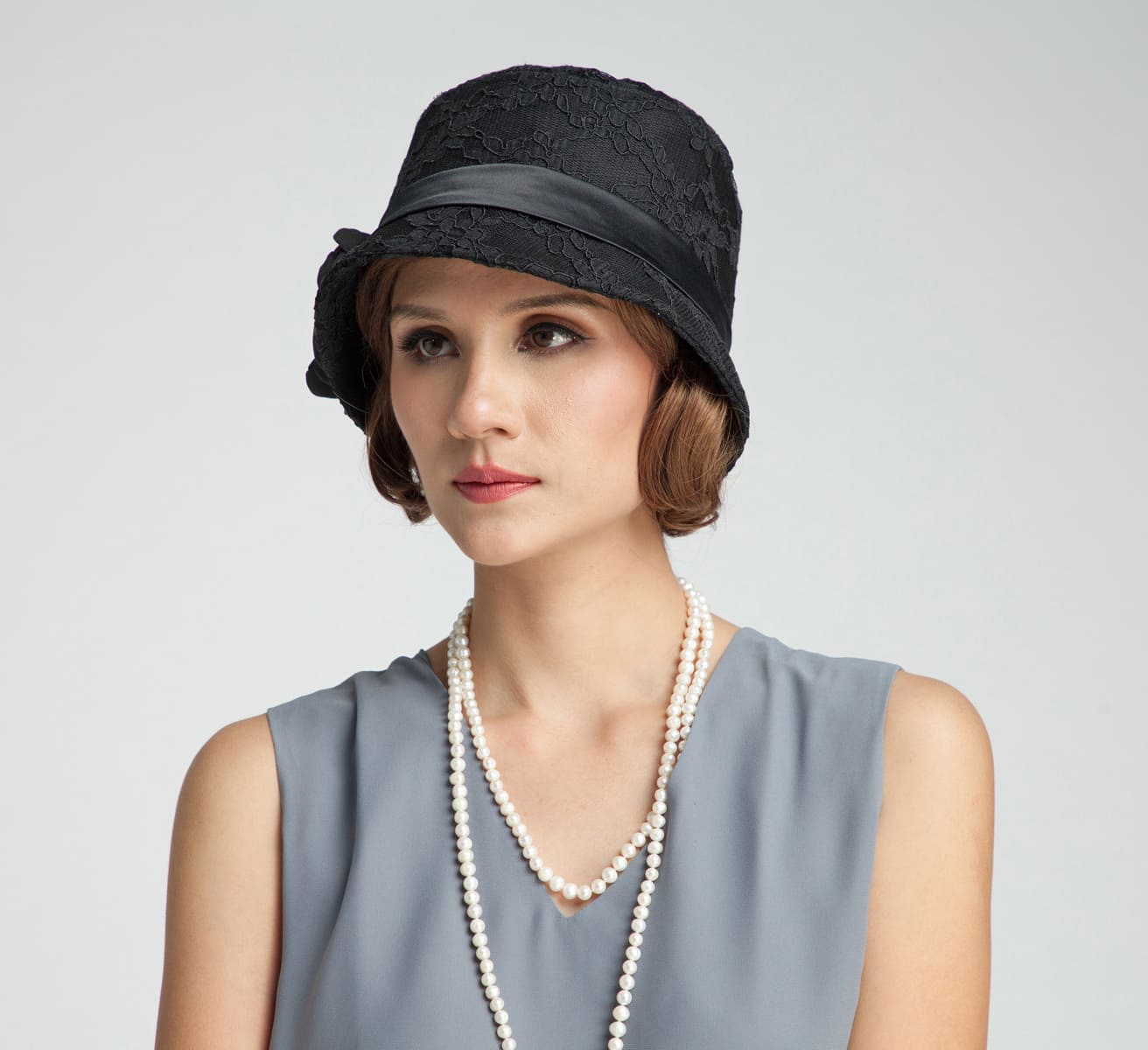 Black 1920s cloche hat with cotton and black lace