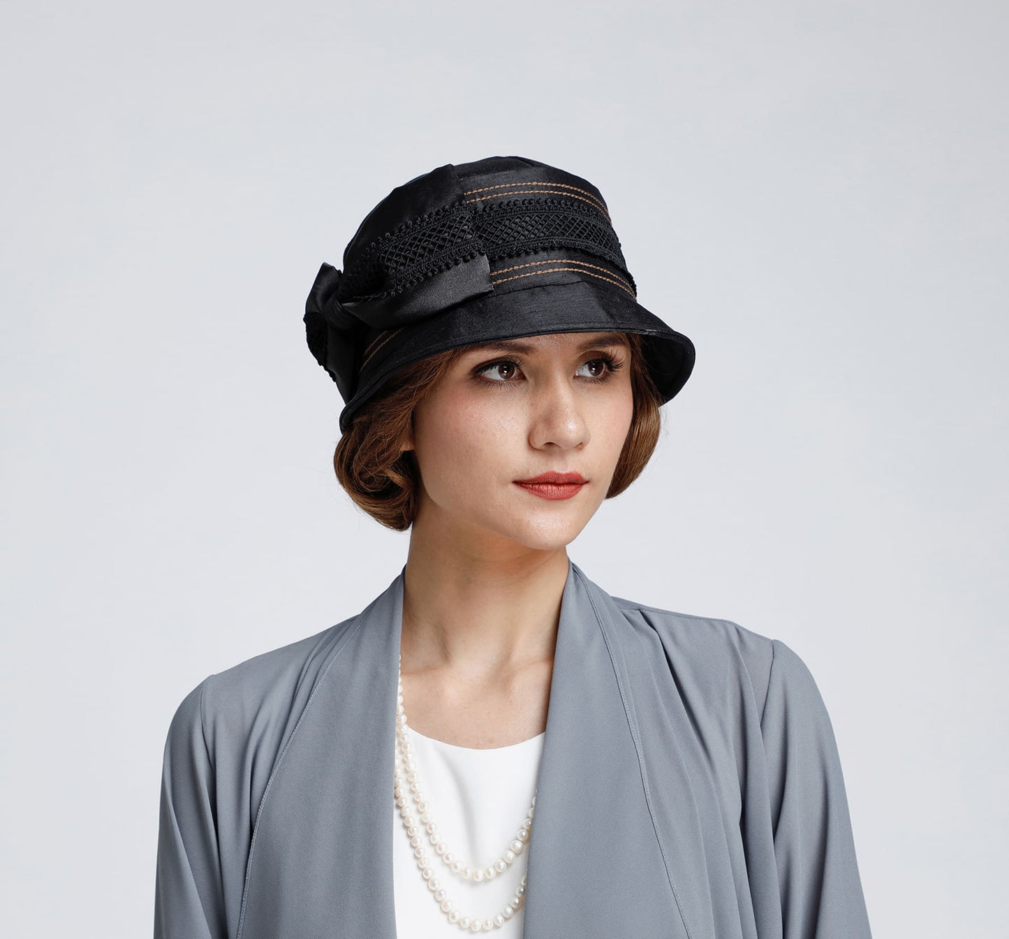 Silk cloche hat in black with a bow and grey lace trim