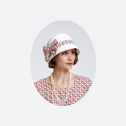 1920s cloche hat with off-white and nude with dark blue and red print - a Roaring Twenties hat
