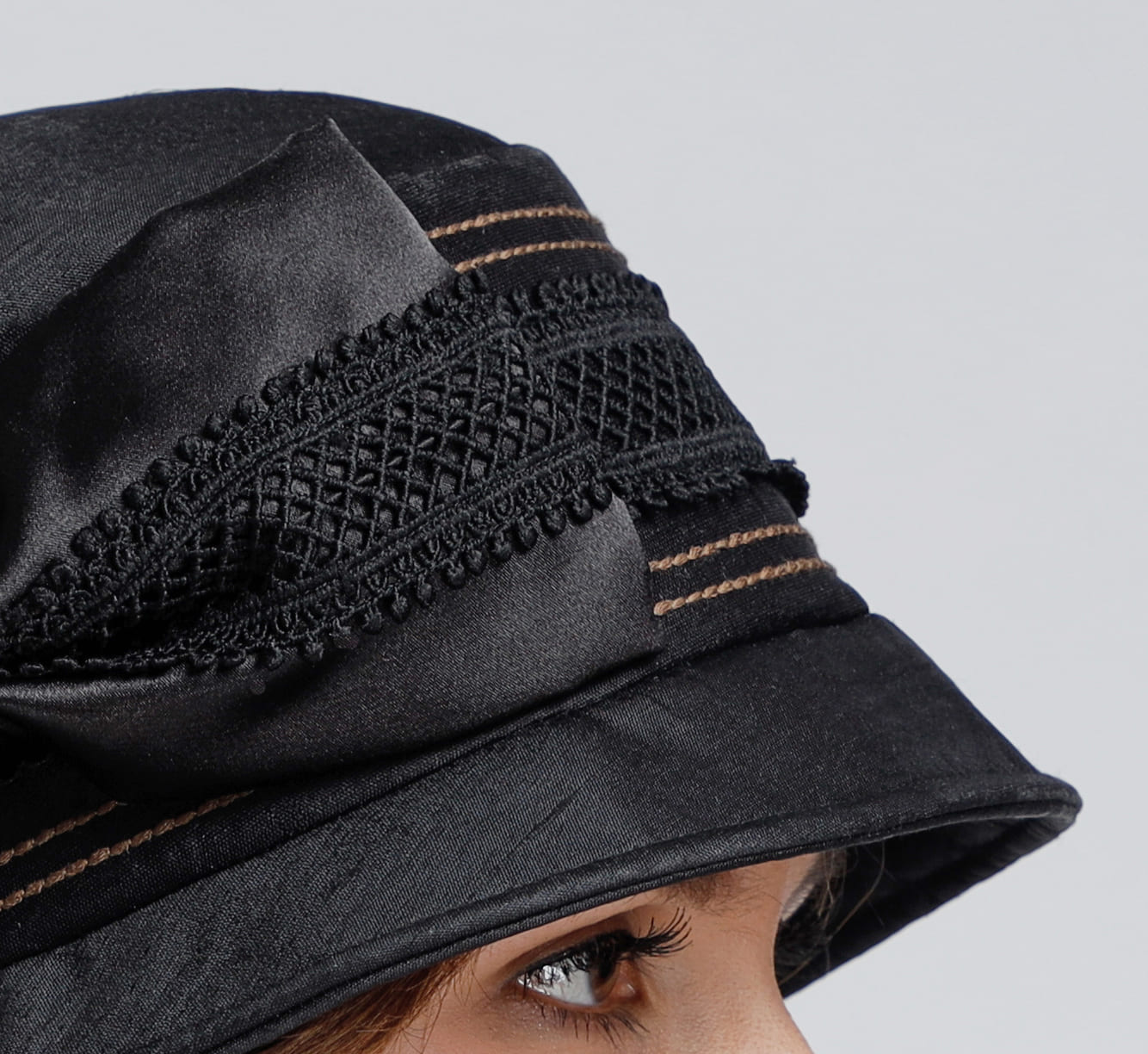 Silk cloche hat in black with a bow and grey lace trim