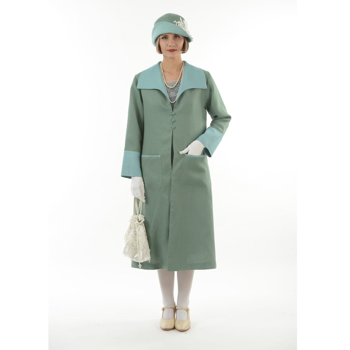 Flapper day coat in muted green linen and pastel blue details