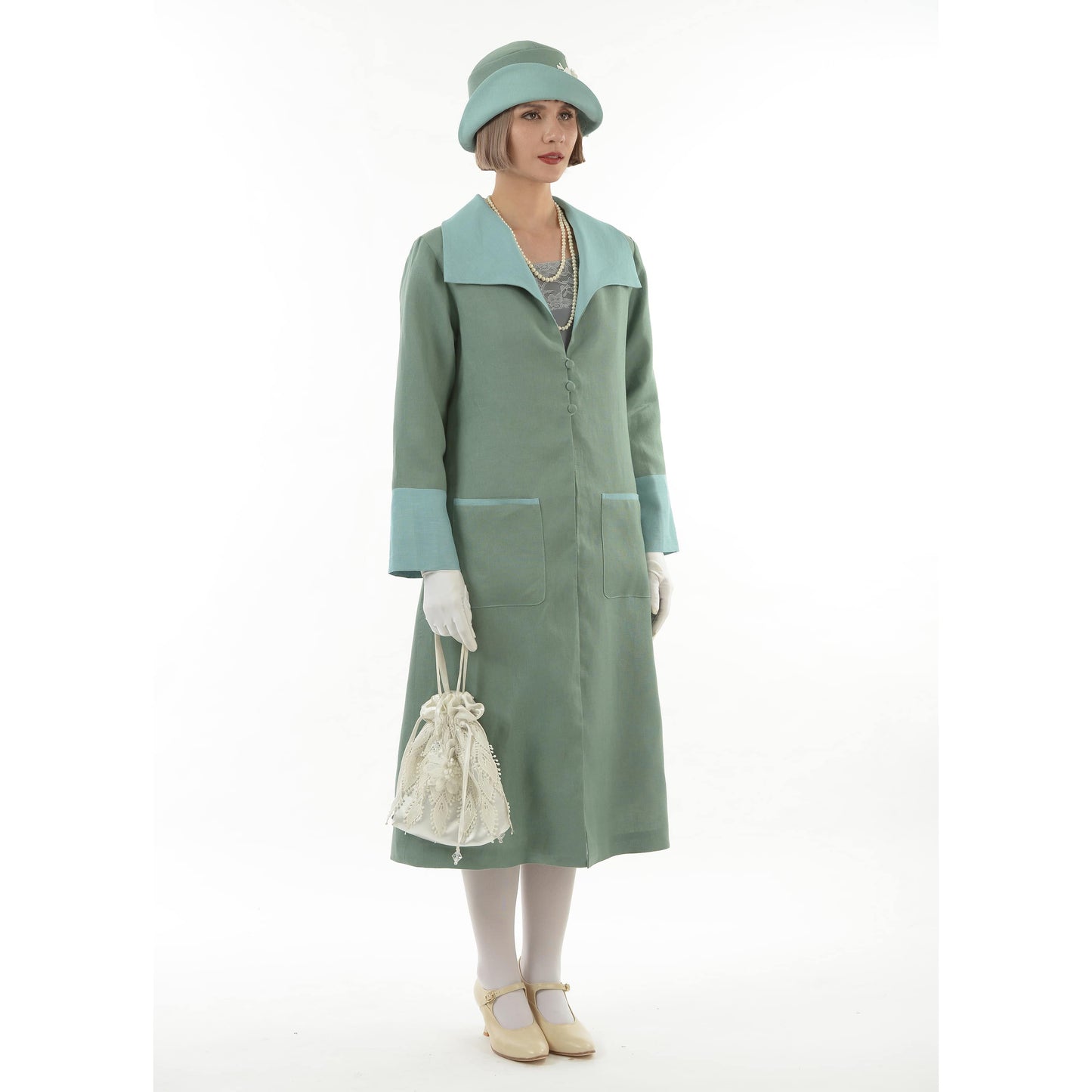 Flapper day coat in muted green linen and pastel blue details