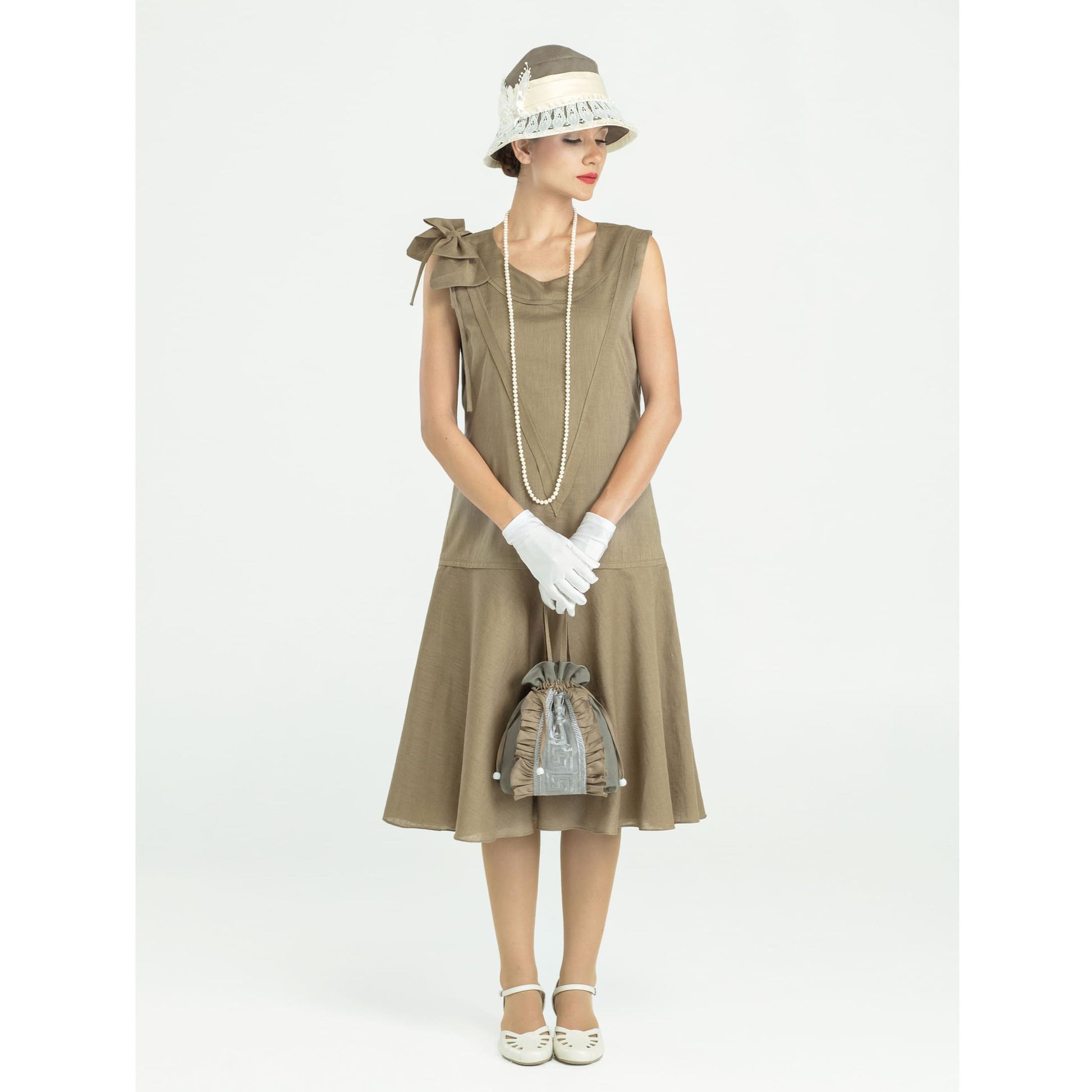 Sleeveless 1920s linen dress in olive green with bow on shoulder - a vintage-inspired Roaring Twenties dress