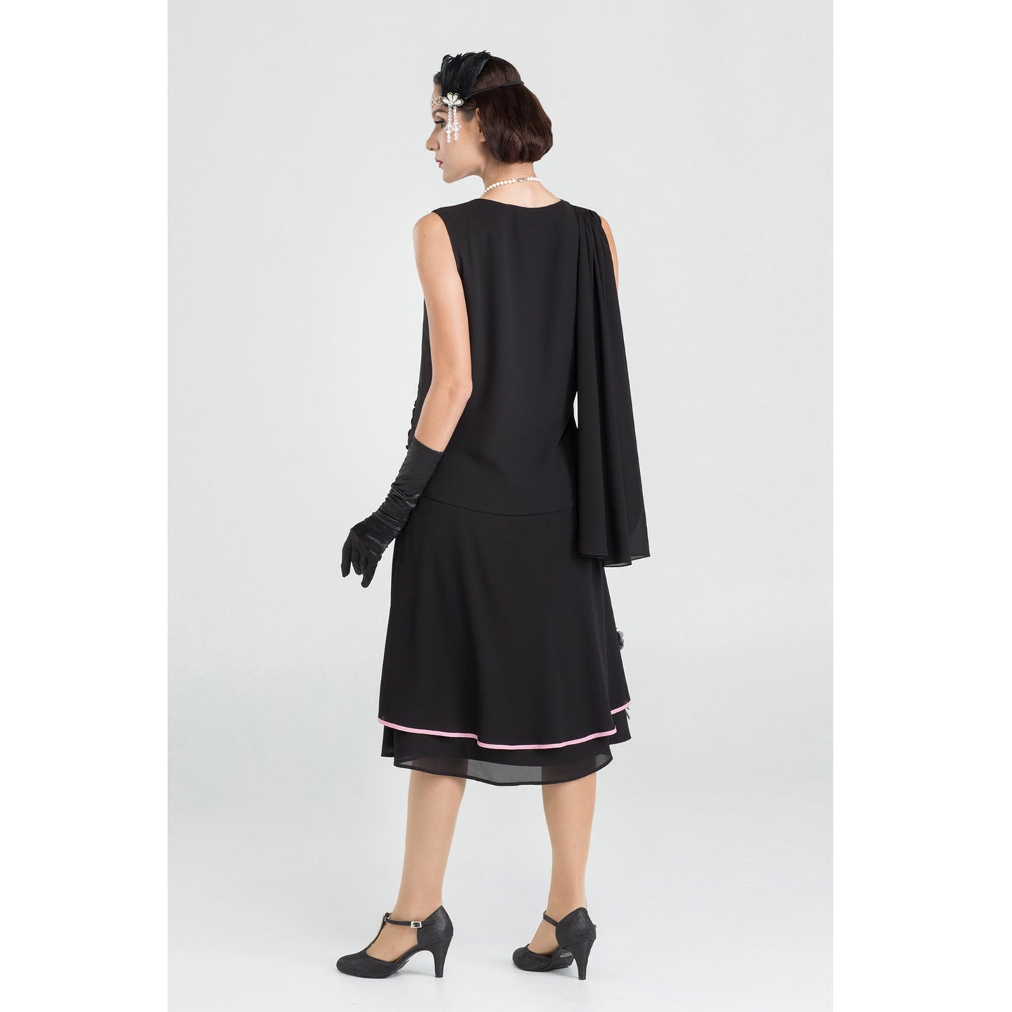 Black 1920s evening dress with a shoulder train