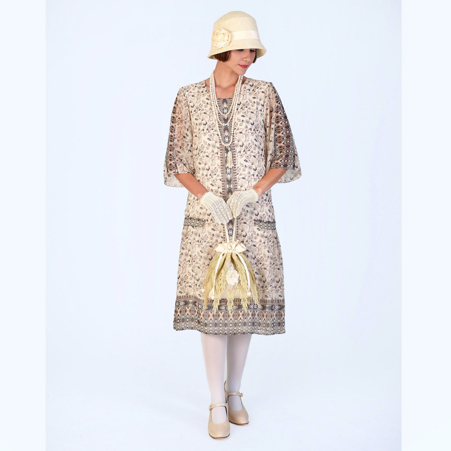 1920s high tea dress in printed cream chiffon with elbow sleeves