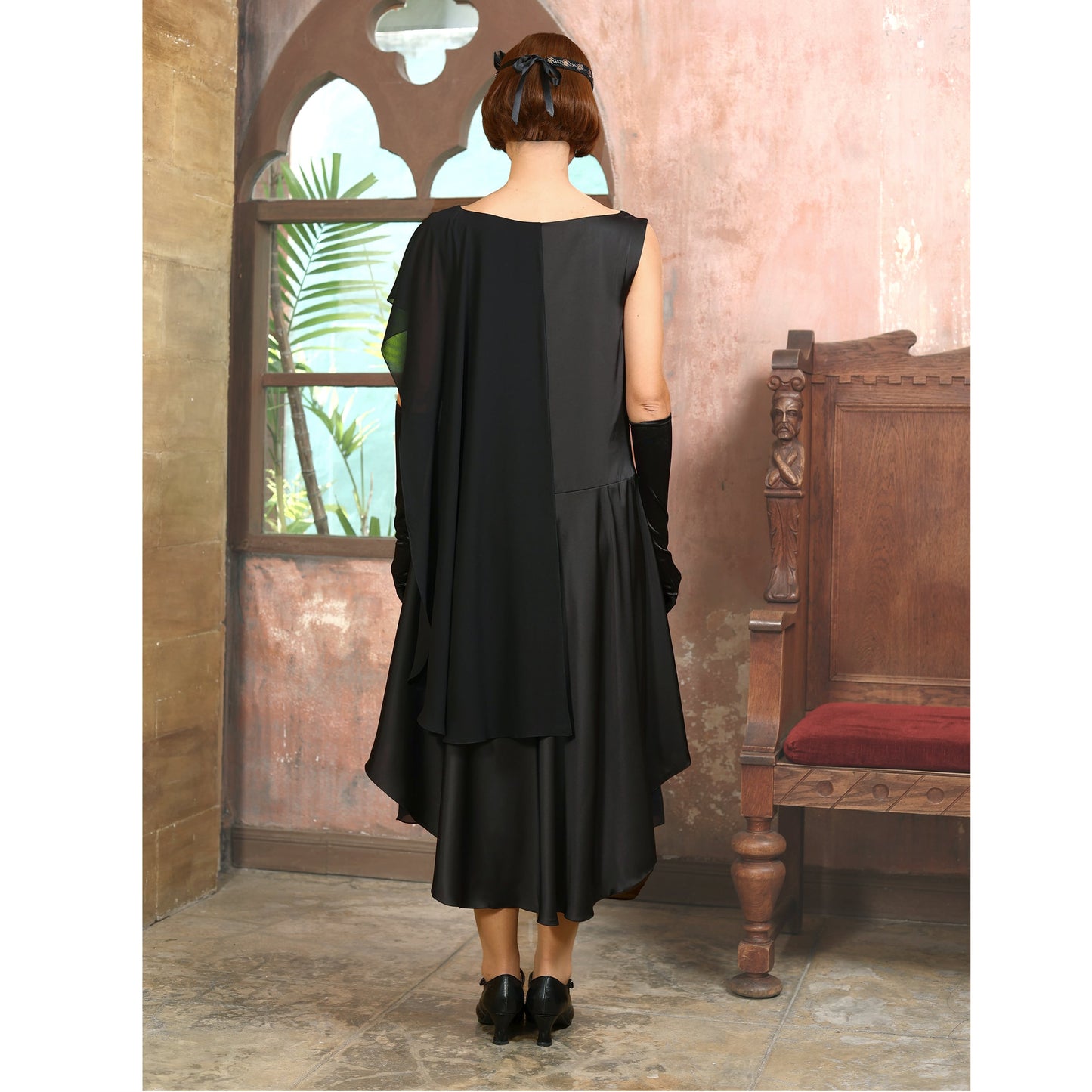 Black 1920s formal evening satin dress with a shoulder train