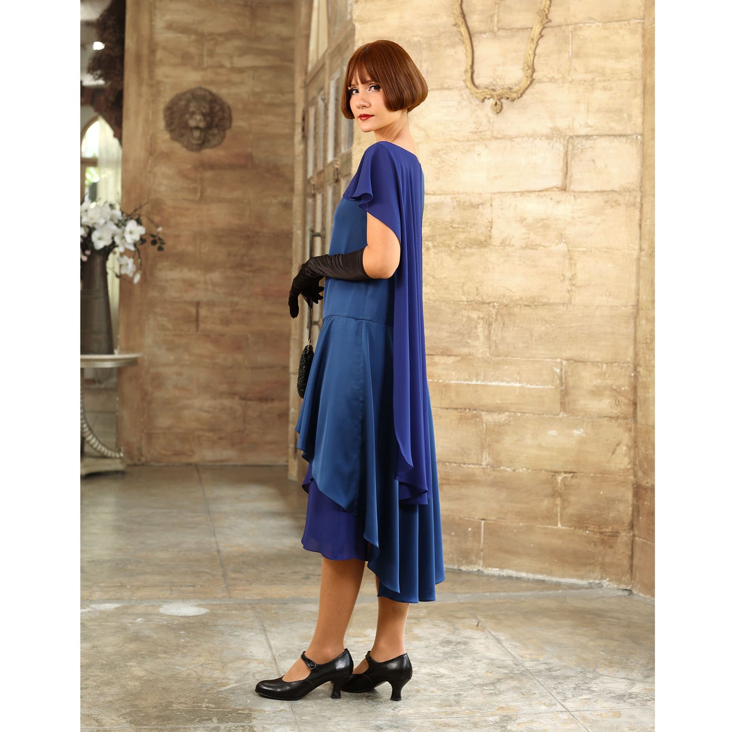 Blue Great Gatsby evening gown with a shoulder train