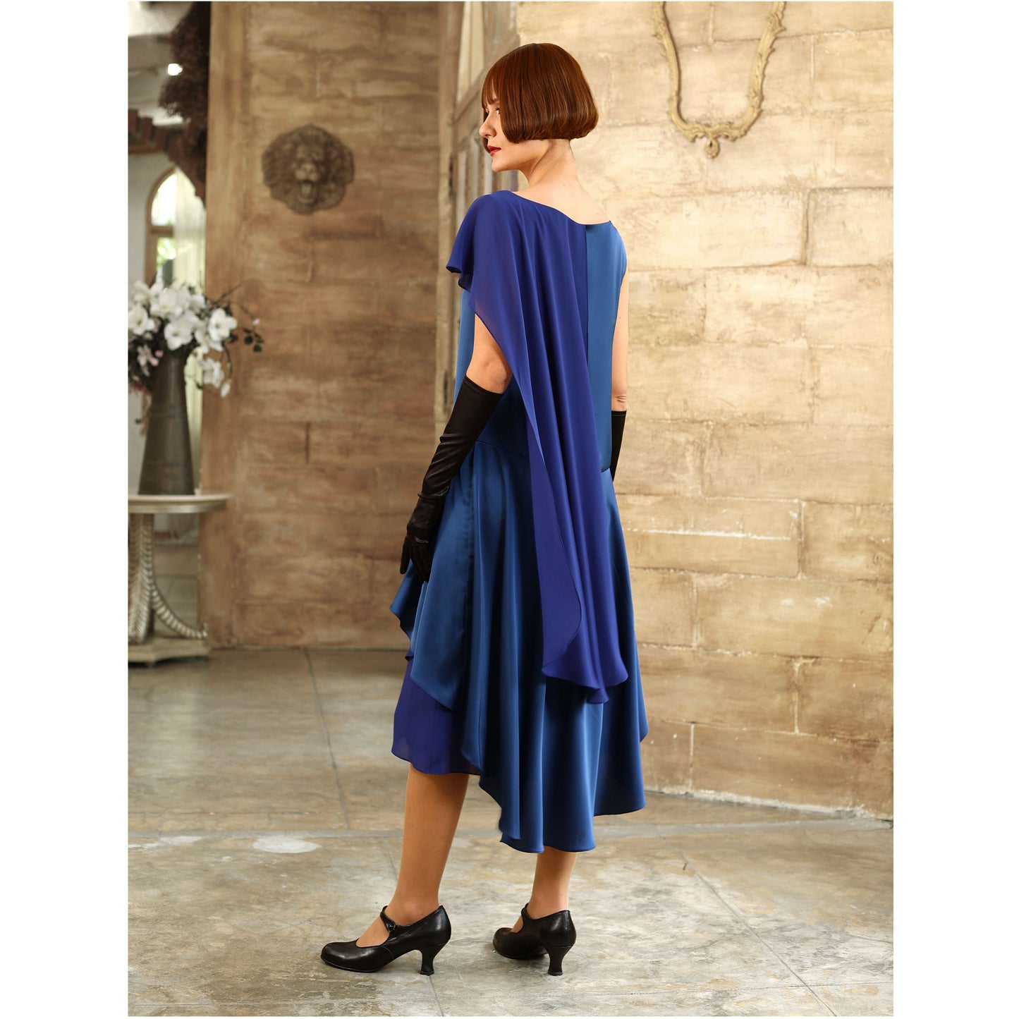 Blue Great Gatsby evening gown with a shoulder train