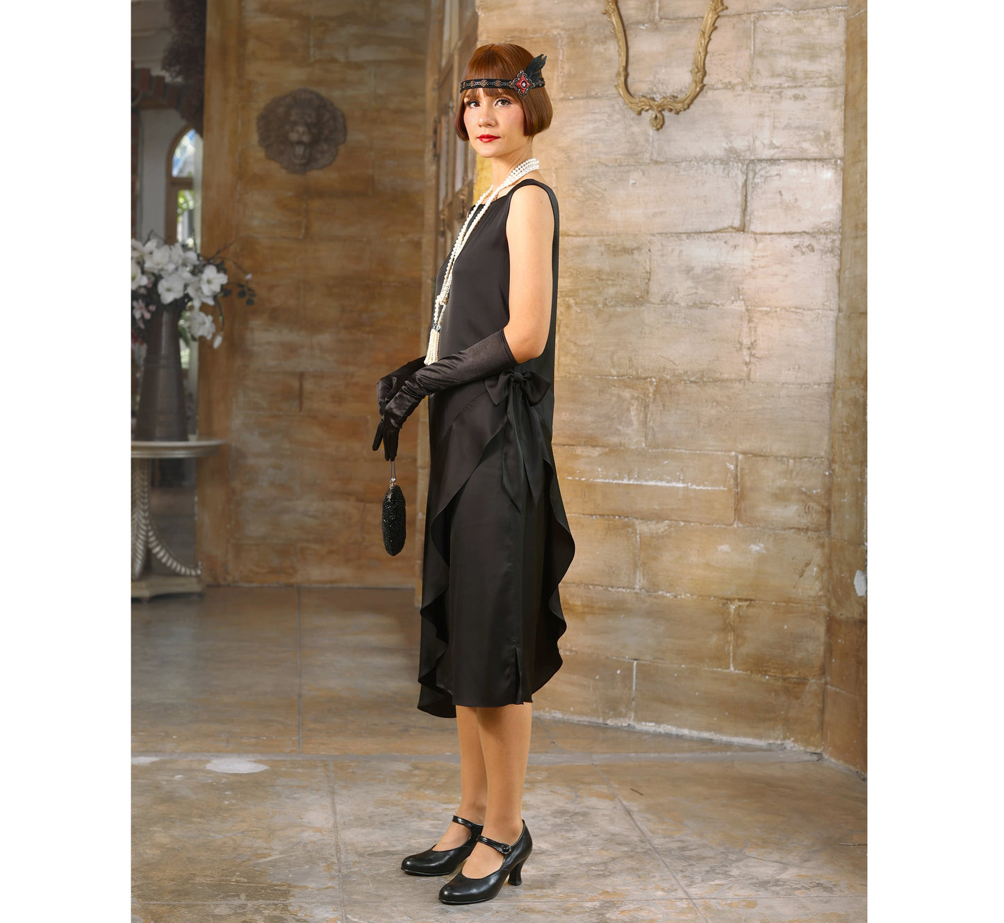 Black satin Great Gatsby dress with a a boat neck. The 1920s dress can be worn as a 20s evening dress, flapper dress or a Lady Mary dress.