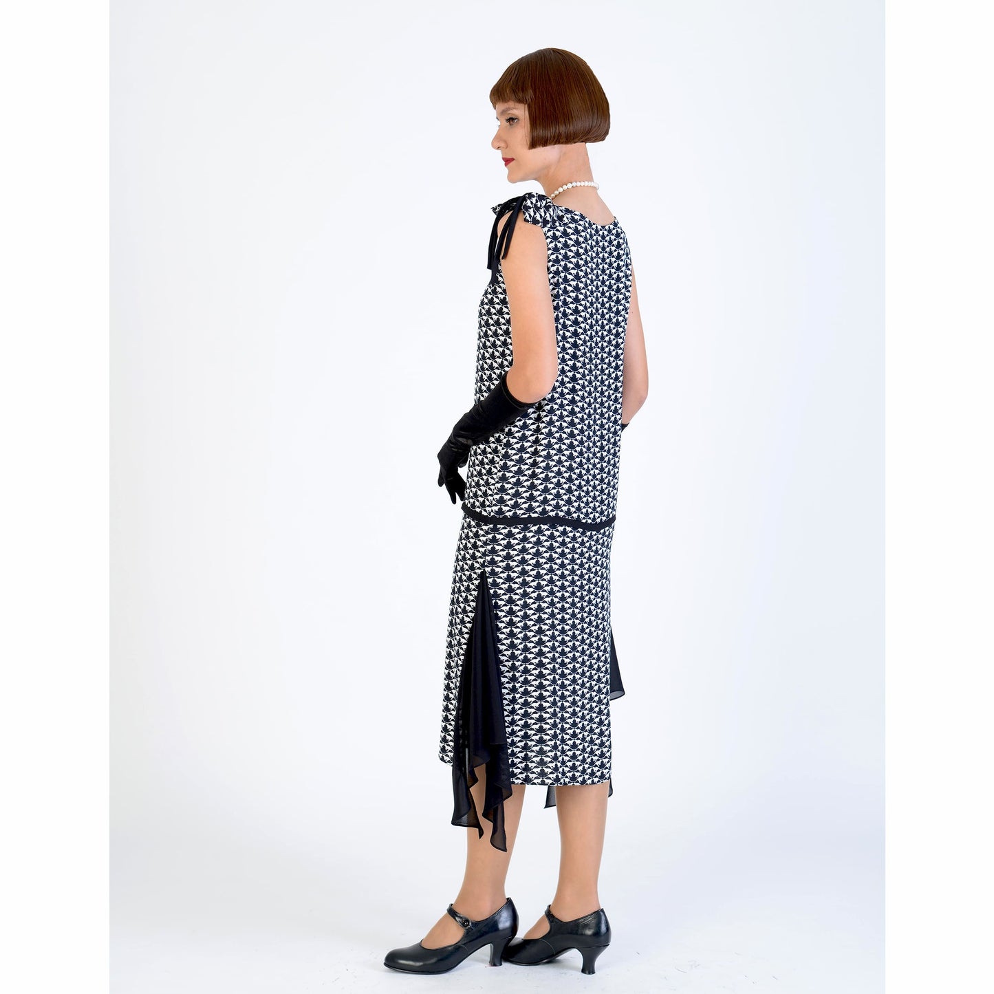 1920s black and white art deoc dress with a shoulder bow