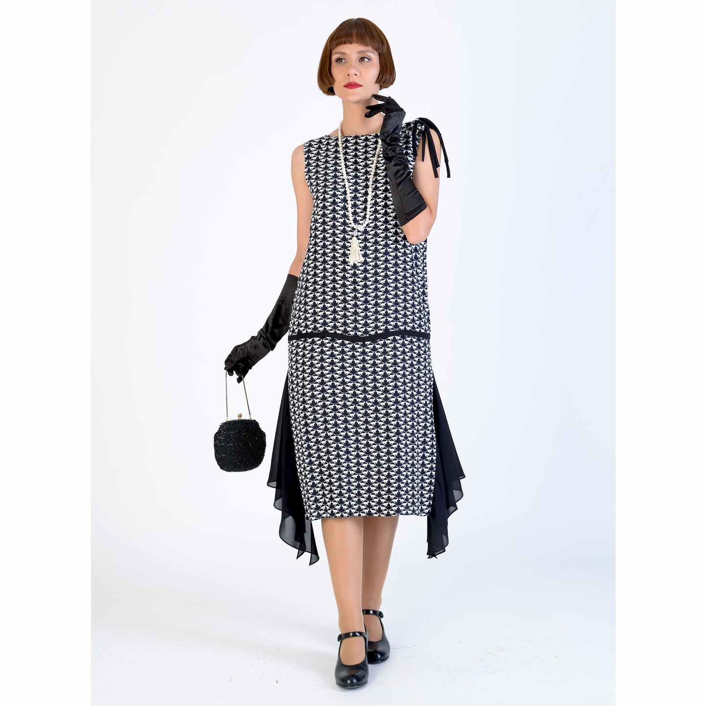 1920s black and white art deoc dress with a shoulder bow