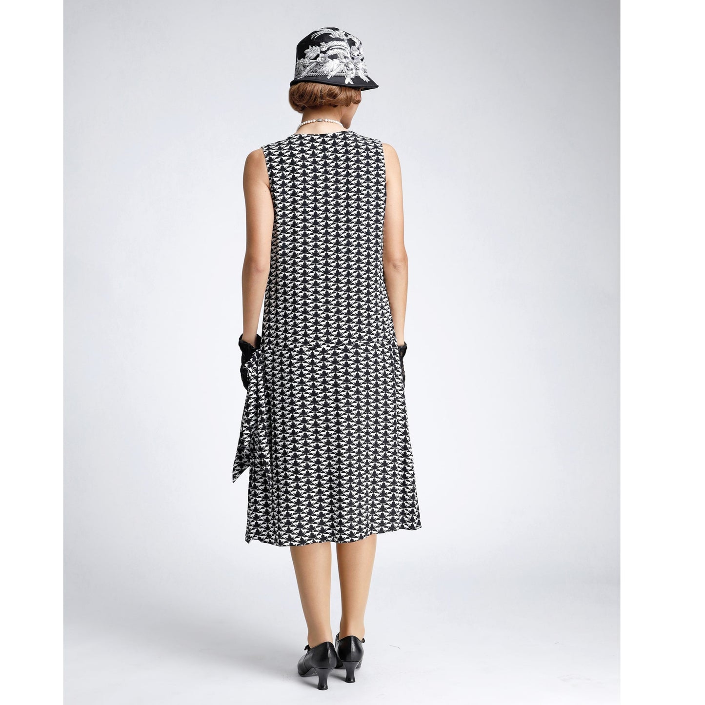 Black/white 1920s-inspired chiffon art deco dress with drape/bow