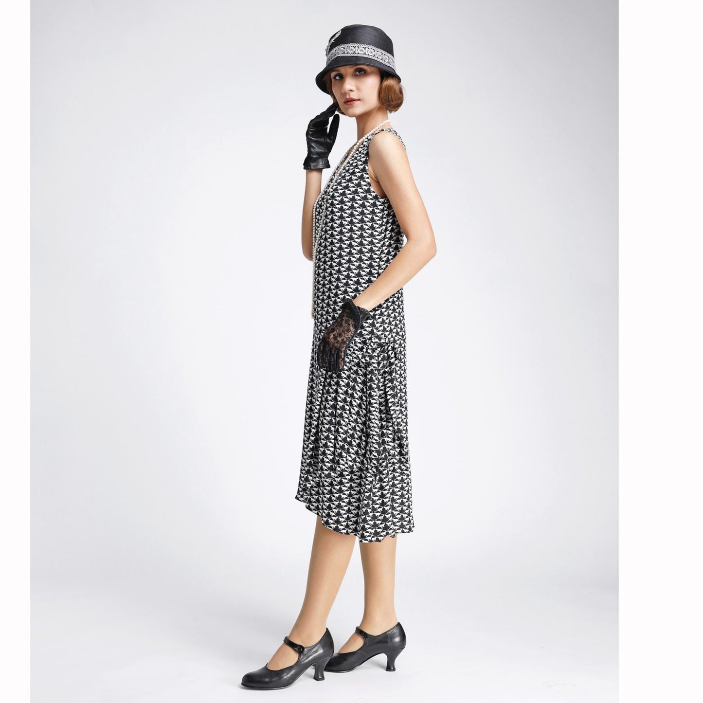 Black/white 1920s-inspired chiffon art deco dress with drape/bow