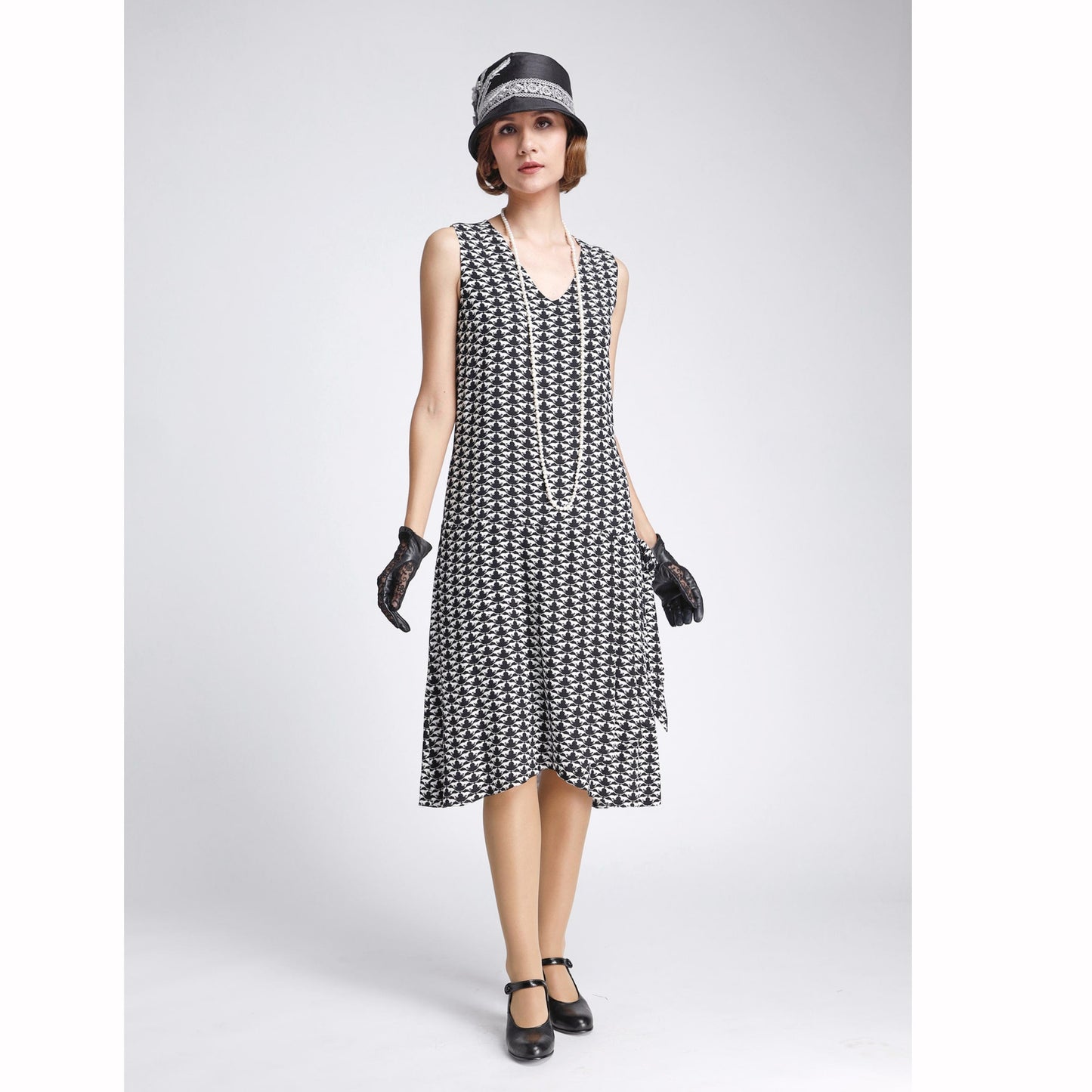 Black/white 1920s-inspired chiffon art deco dress with drape/bow