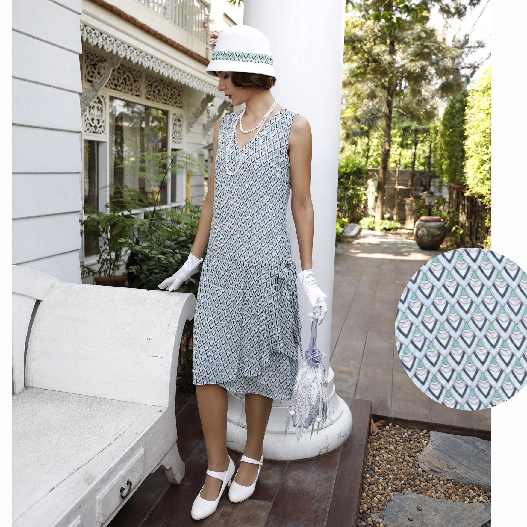 Chiffon 1920s dress in light blue deco print with drape and bow - a vintage-style 1920s dress