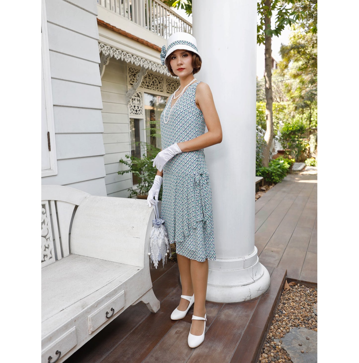 Chiffon 1920s dress in light blue deco print with drape and bow