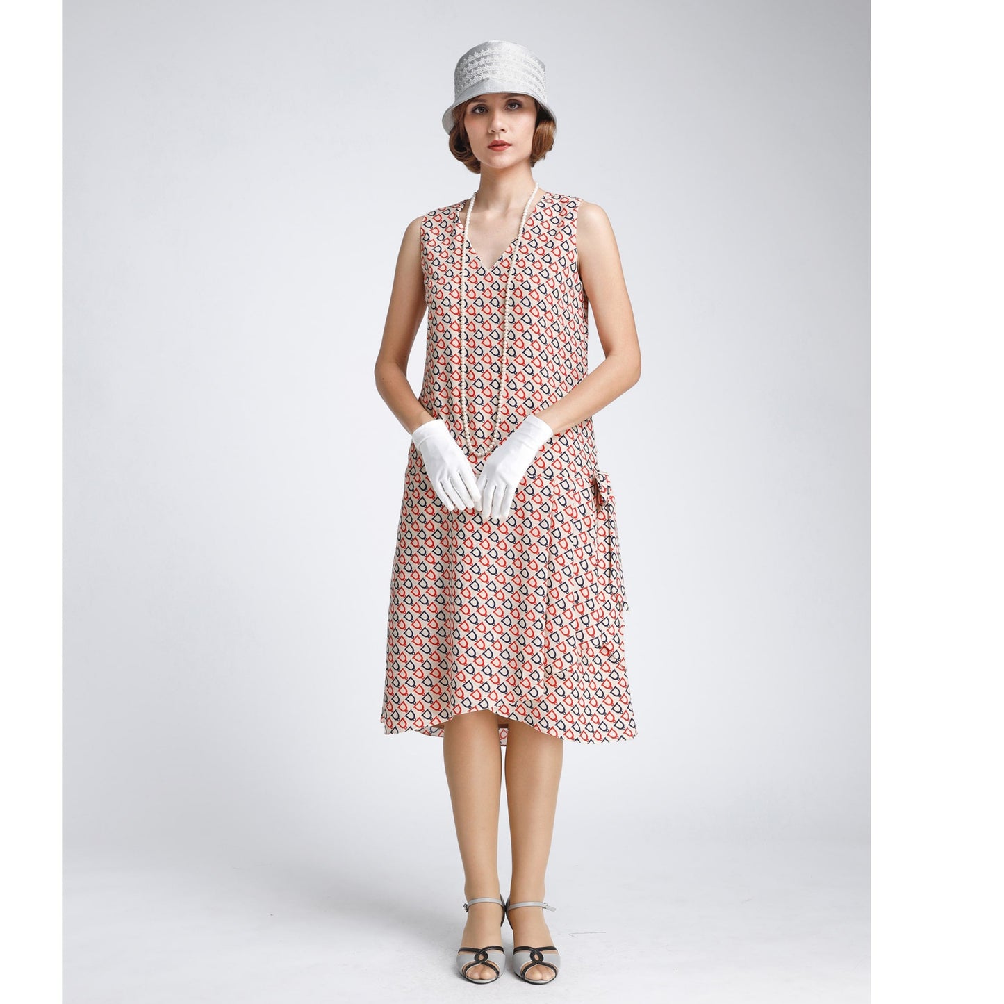Art deco 1920s-inspired Gatsby dress in nude, dark blue and red print