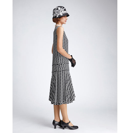 Black and white art deco viscose flapper dress with a ruffled skirt detail. The 1920s dress can be worn as Great Gatsby dress or 1920s high tea dress.
