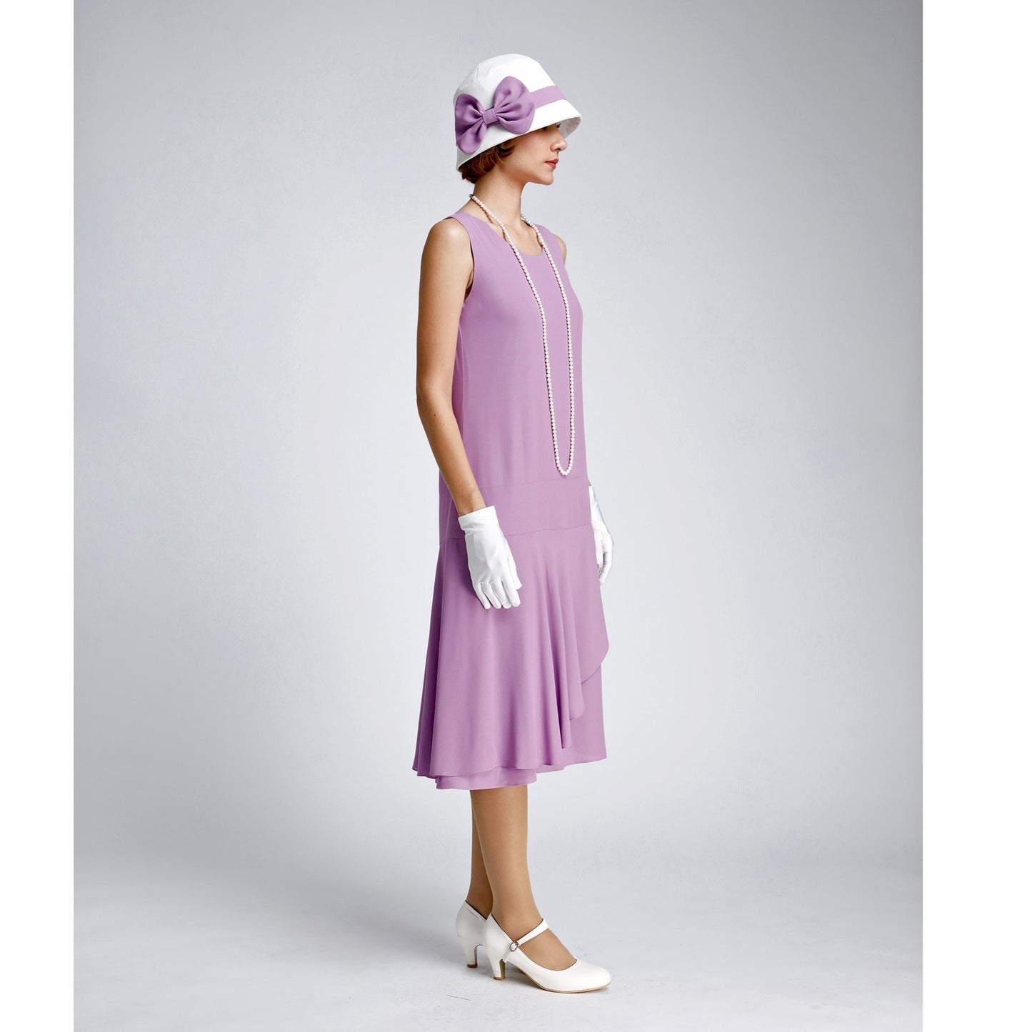 Purple 20s high tea dress with a ruffled skirt detail. The 1920s dress can be worn as a Great Gatsby summer dress or Charleston dress.