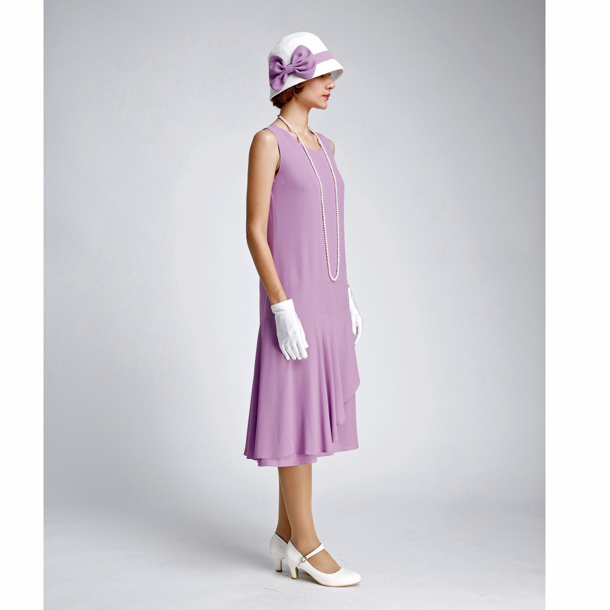 Purple 20s high tea dress with a ruffled skirt detail. The 1920s dress can be worn as a Great Gatsby summer dress or Charleston dress.
