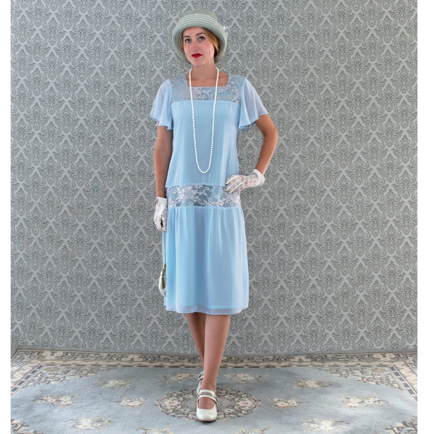 Great Gatsby day dress inspired by 1920s fashion made of light blue chiffon and silver grey lace fabrics and with flutter sleeves.